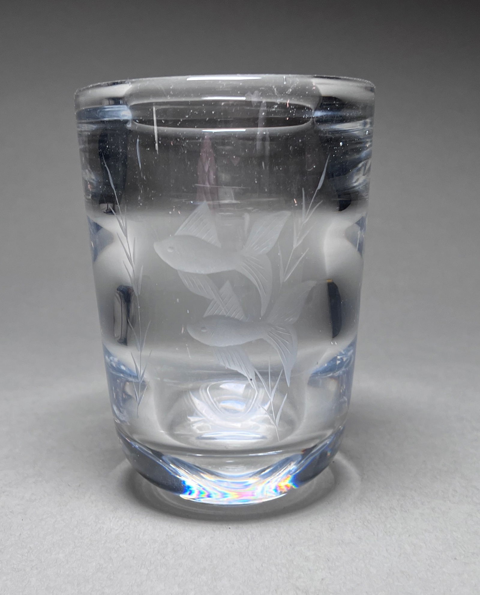 Modernist Glass Vase with Carved fish motifs by Orrefors, Sweden circa 1950's: Orrefors Glasbruk is a famous Swedish glassworks company known for its high-quality crystal and glass products. The company was founded in 1898 in the small village of Orrefors, located in the provinc