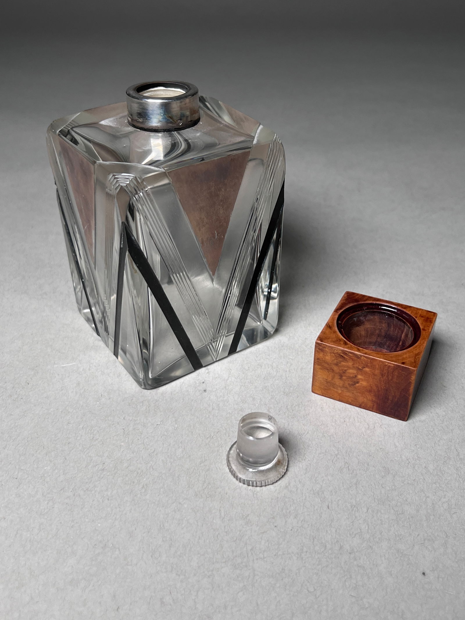 French Art Deco Glass Perfume Bottle - 1920's: French Art Deco Glass Perfume Bottle with Karelian Birch Stopper. Fine quality glass perfume bottle with Karelian birch bottle stopper. Under the wooden cover is a glass threaded cap. Glass, Karelian