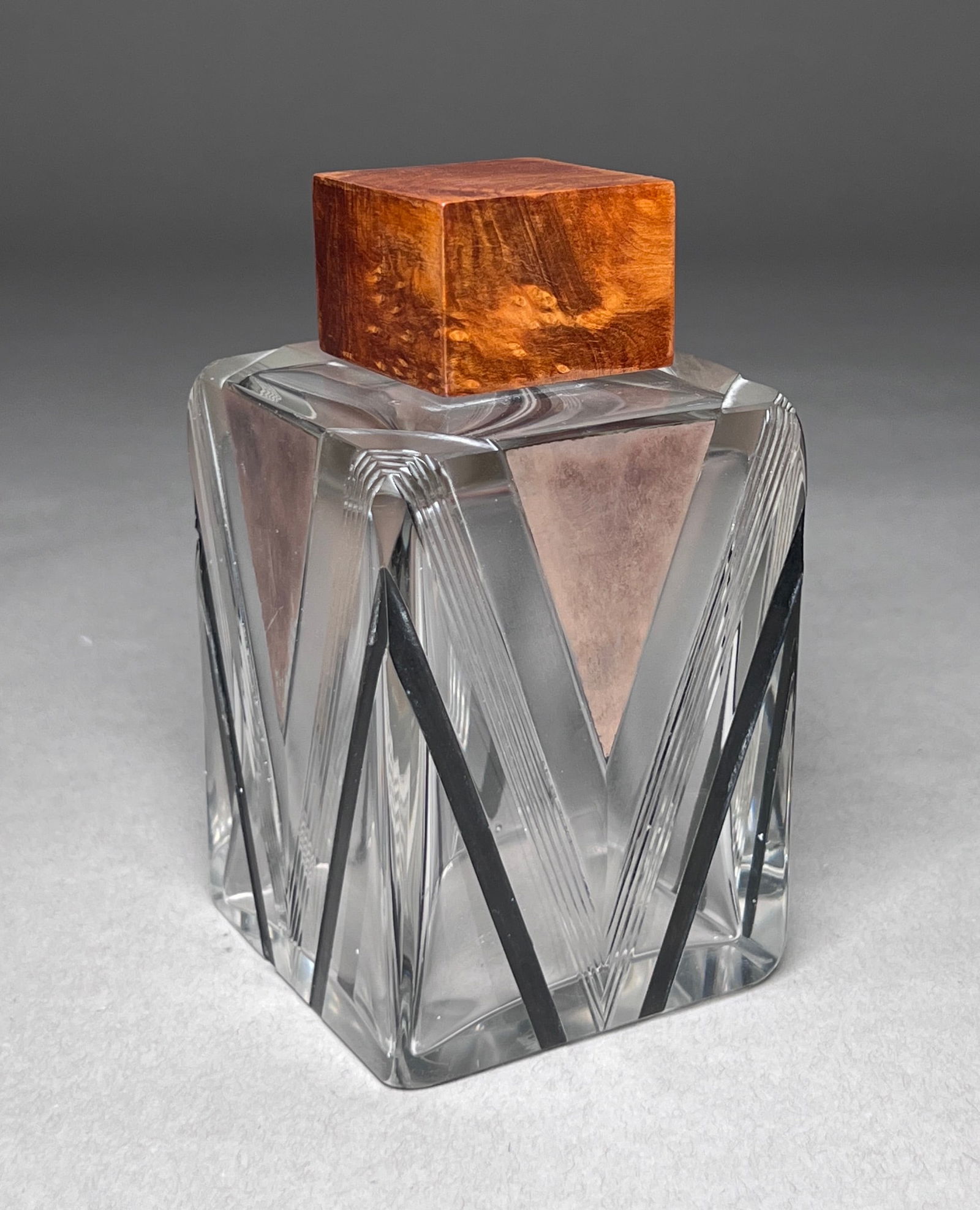 French Art Deco Glass Perfume Bottle - 1920's: French Art Deco Glass Perfume Bottle with Karelian Birch Stopper. Fine quality glass perfume bottle with Karelian birch bottle stopper. Under the wooden cover is a glass threaded cap. Glass, Karelian