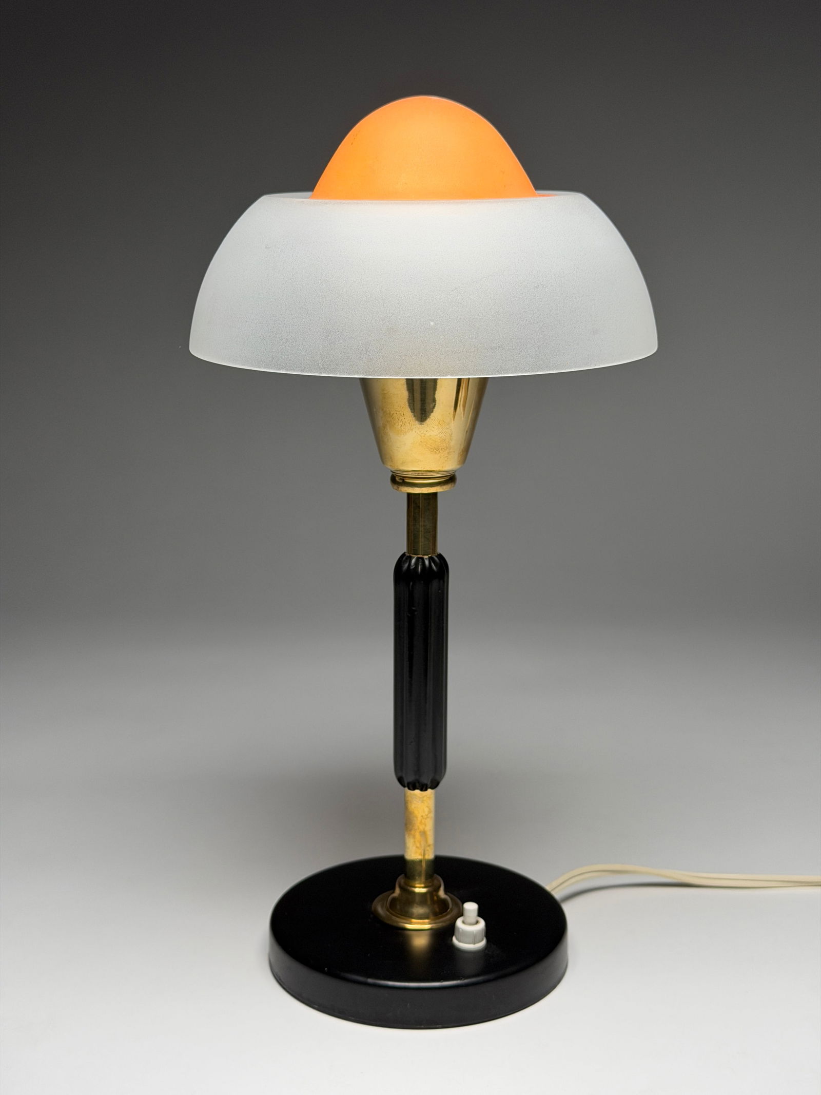 MCM Fog & Morup "Fried Egg" Glass, and Black Lacquered Metal Table Lamp, Mid-20th Century: MCM Fog & Morup "Fried Egg" Glass, and Black Lacquered Metal Table Lamp, Mid-20th Century A refined mid-century modern table lamp featuring a broad dome shade in white frosted glass, crowned by a loos