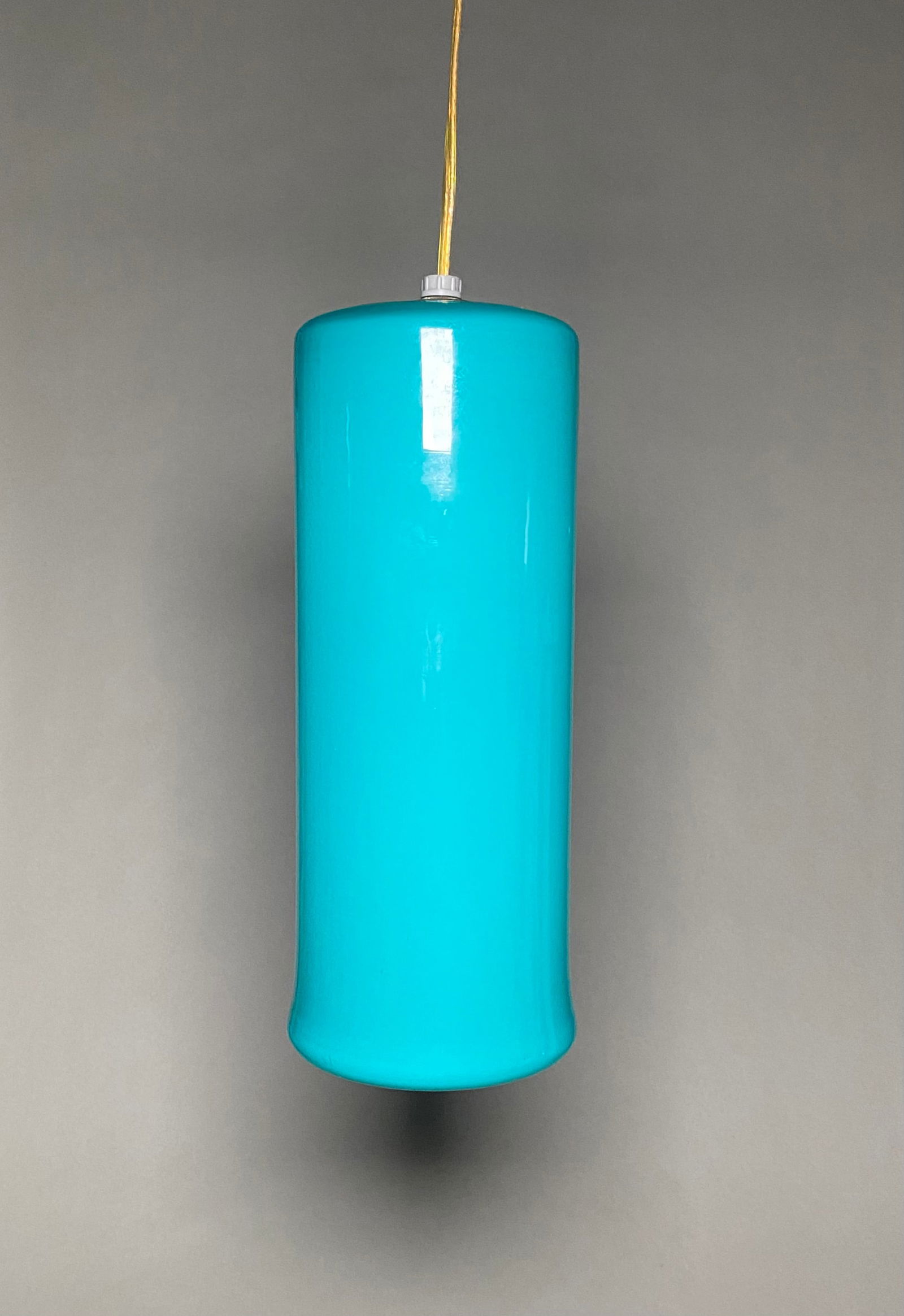 Massimo Vignelli Pendant Turquoise Glass lamp for Venini, Italy, 1950s.: The Massimo Vignelli pendant Turquoise Glass Hanging lamp for Venini, Italy, crafted in the 1950s, stands as a striking example of modernist design, possessing an alluring beauty and desirability for