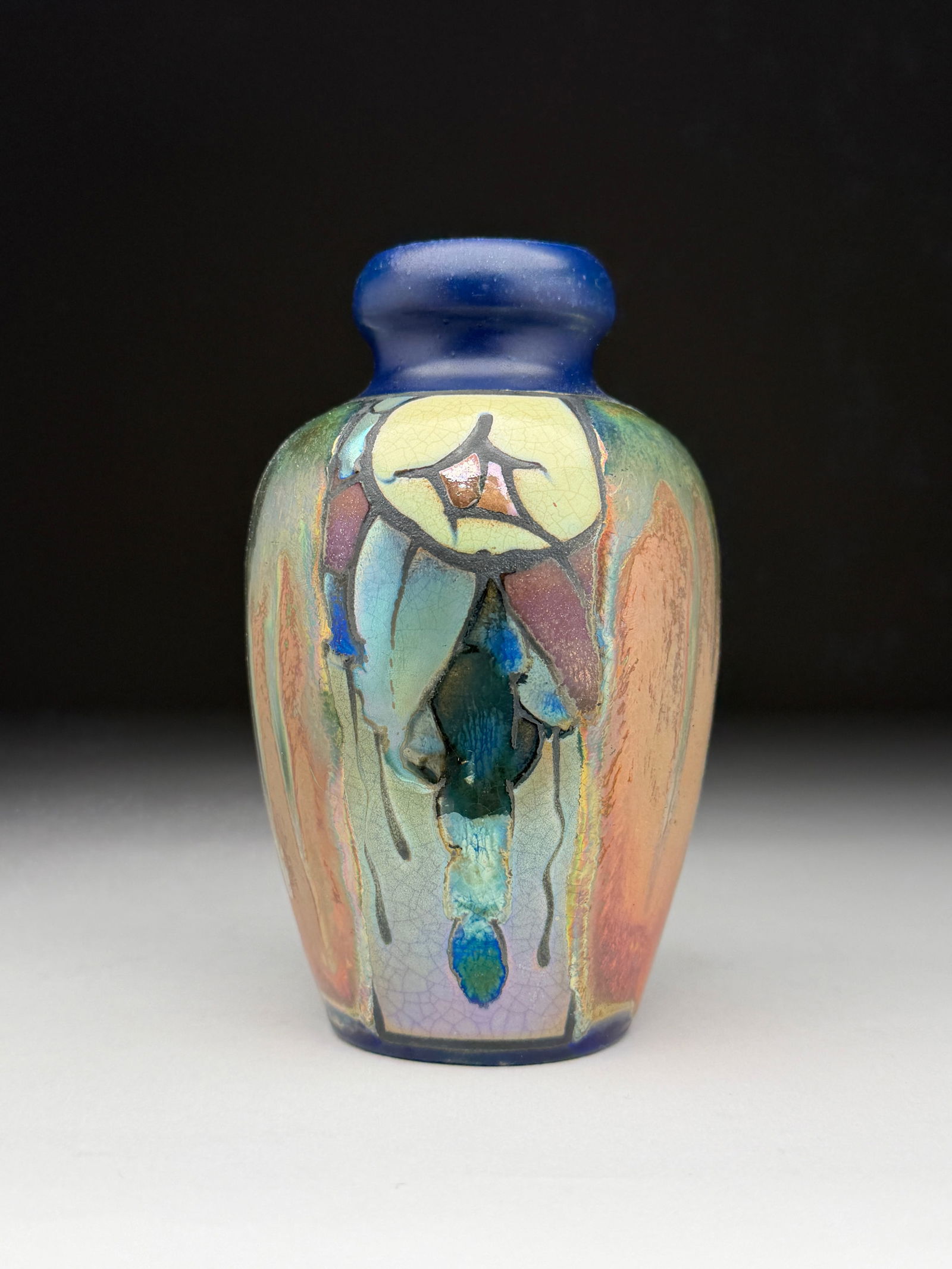 Jean Barol Art Nouveau Ceramic Vase with Stylized Floral Motif - Early 20th Century: Jean Barol Art Nouveau Ceramic Vase with Stylized Floral Motif - Early 20th Century This ceramic vase by Jean Barol presents a compact ovoid form crowned with a thick, rounded cobalt blue neck that co