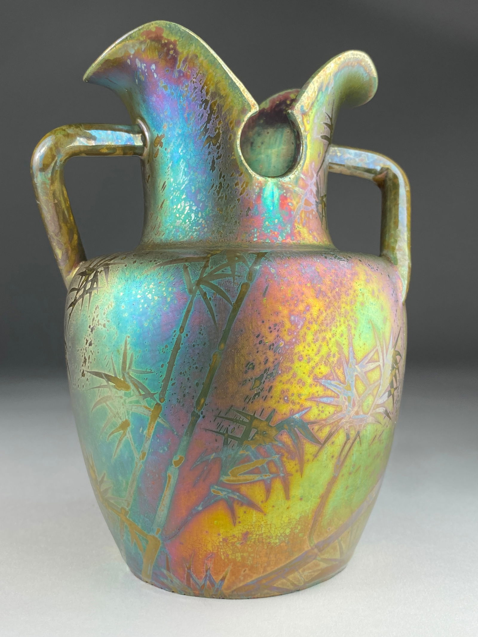Iridescent Art Nouveau Bamboo Pitcher by Delphin Massier: Iridescent Art Nouveau Bamboo Vase/Pitcher by Delphin Massier This exquisite Art Nouveau pitcher by Delphin Massier is a striking example of the period's dedication to intricate detail and organic bea