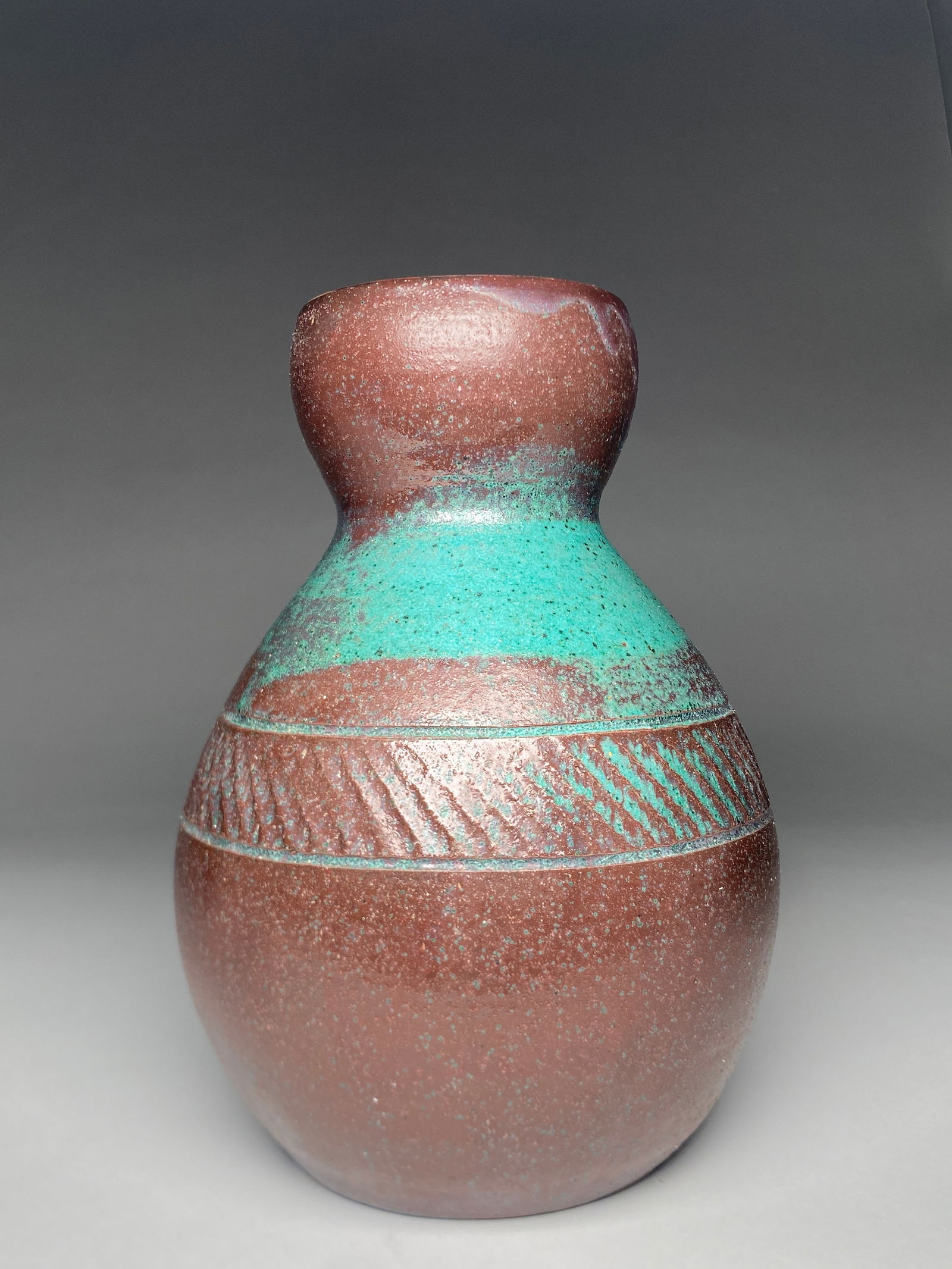 Eugene Lion & Paul Jeanneney Glazed Stoneware Ovoid Striated Vase - Early 20th Century: Eugene Lion & Paul Jeanneney Glazed Stoneware Ovoid Striated Vase - Early 20th Century A tall, ovoid vase with a narrow neck and slightly flared rim, featuring a pronounced midband encircled with diag
