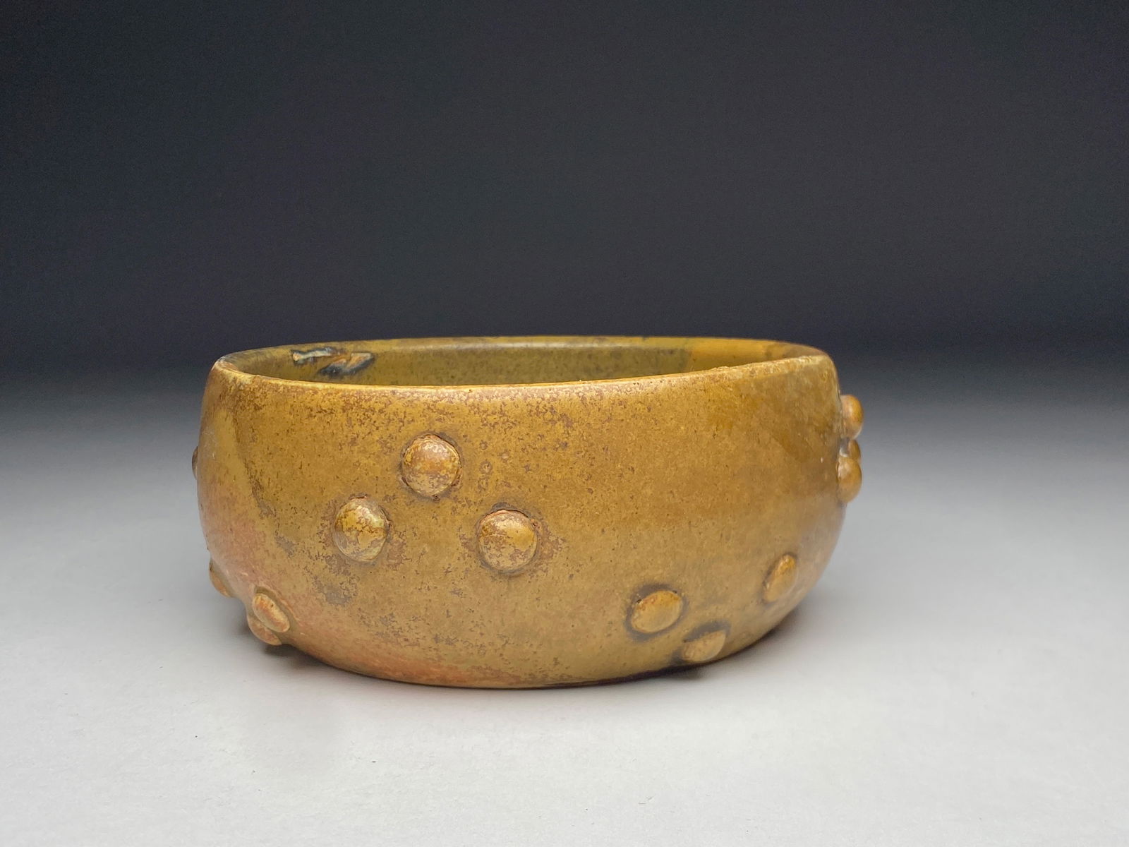 Paul Jeanneney (1861-1920), stoneware hemispheric bowl with applied bosses - late 19th / early 20th: Paul Jeanneney (1861-1920), stoneware hemispheric bowl with applied bosses - late 19th / early 20th century This is a shallow hemispheric ceramic bowl featuring a distinctive lush golden brown polychr