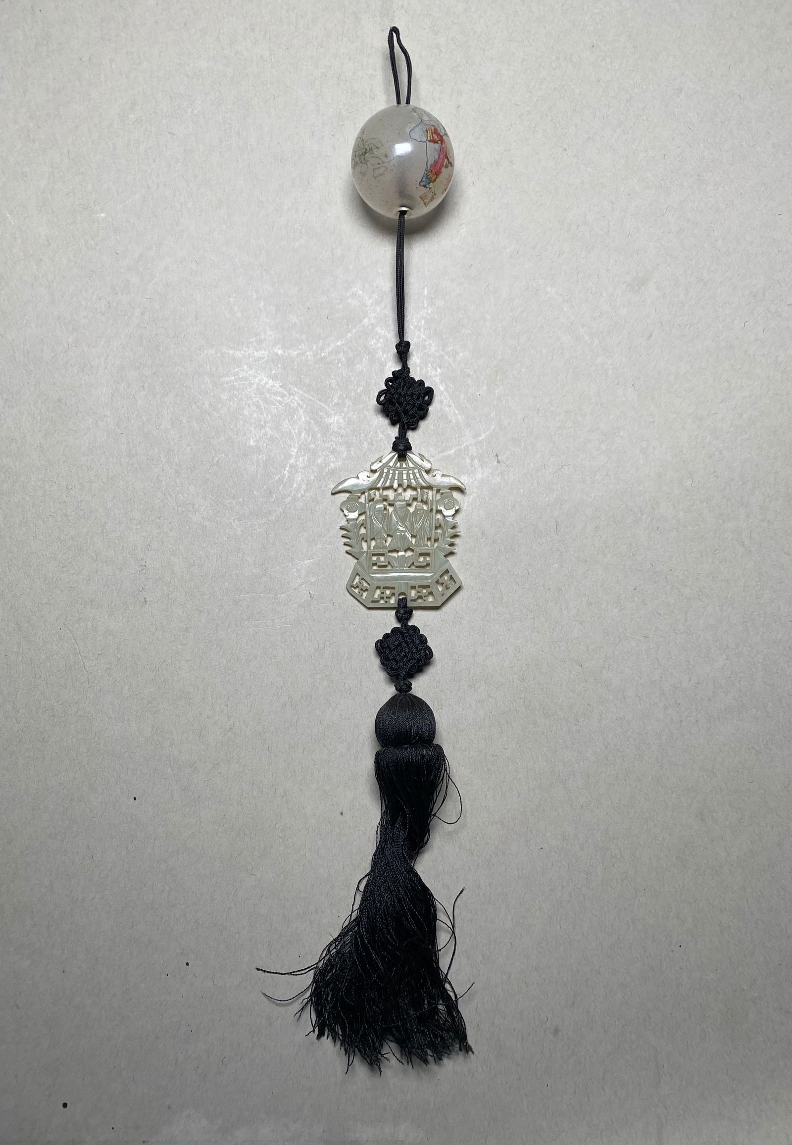 Chinese Jade Ornament with Black String and Jade Amulet: Jade ball with black string and nephrite jade carving amulet. Jade, string Length: 16" (40.6 cm)
