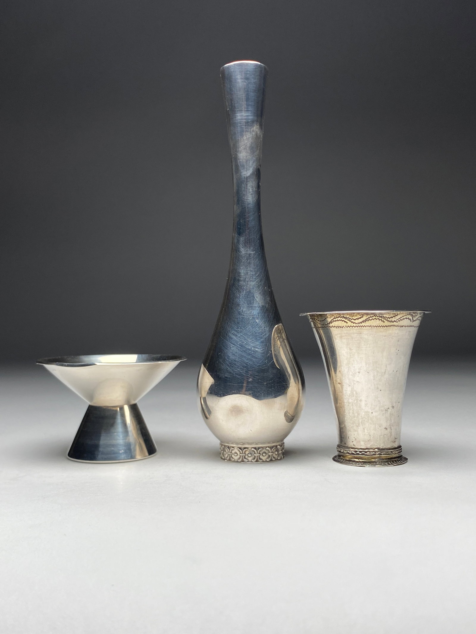 Mid-Century Swedish Sterling Silver Candle Holder and Vases 20th Century: Mid-Century Swedish Sterling Silver Candle Holder and Vases 20th Century On the left is a sculptural mid-century Swedish sterling silver candle holder by GAB, Stockholm, 1961. Executed in a clean, geo