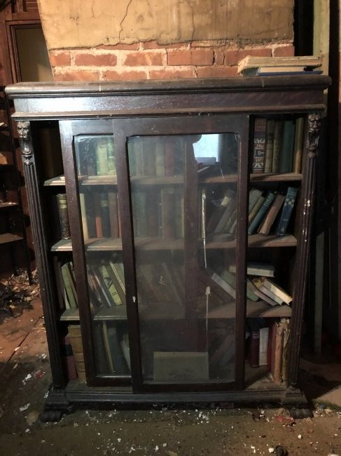 Antique lion head accent sliding door bookcase (1 of 2)