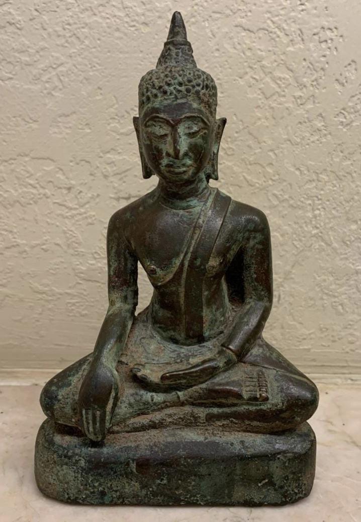 12/13th Century Thai Bronze Buddha: Wonderful bronze image of the Buddha in Calling To Earth Mudra, attributed to the 12th Century. This figure is approximately 4.5 inches tall and was sold at Chinndar Imports in Clayton, Missouri, whic