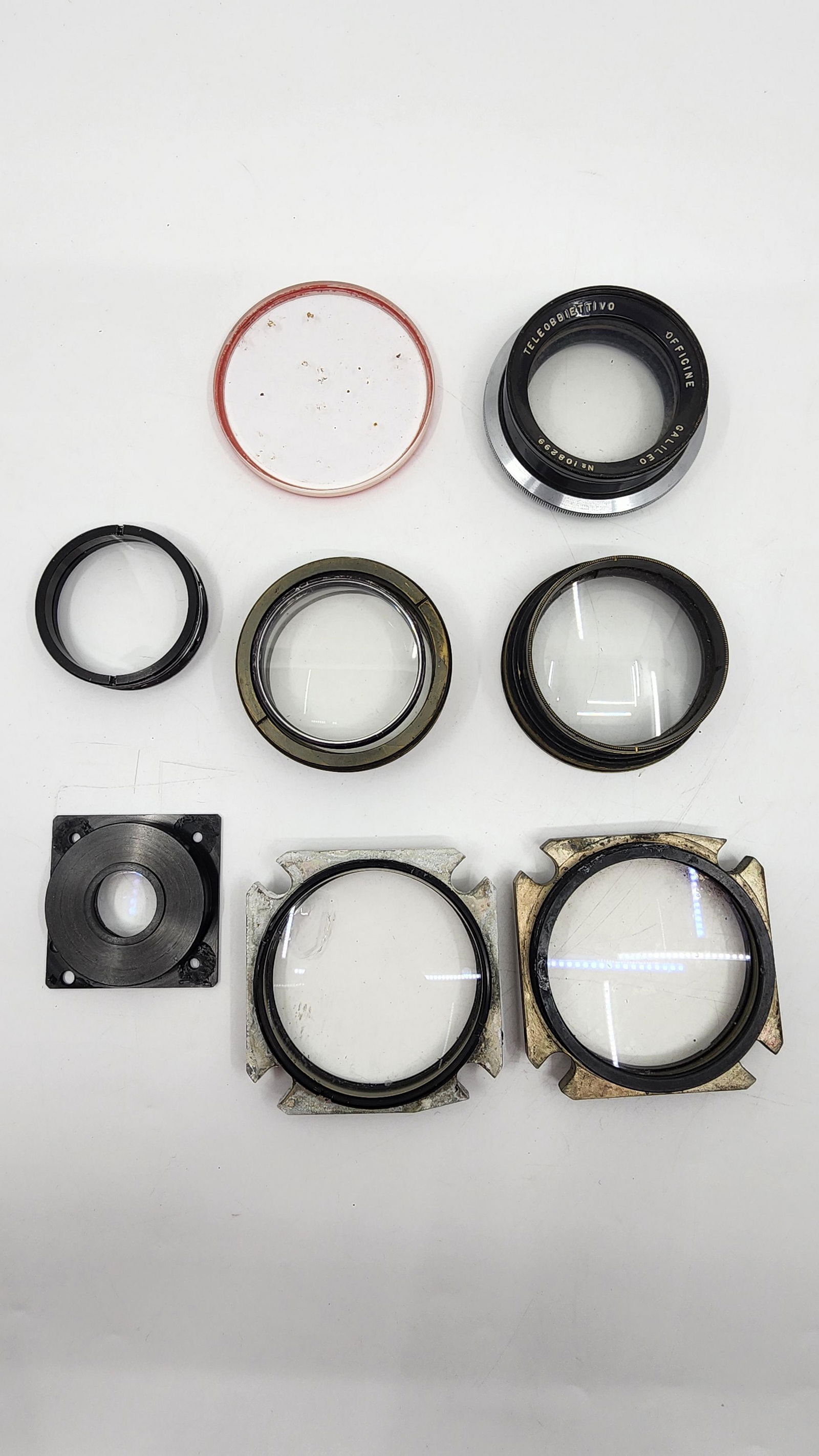 Lot of 9 Vintage Optical Glass for cameras and telescopes mostly mounted on brass frame (1 of 1)