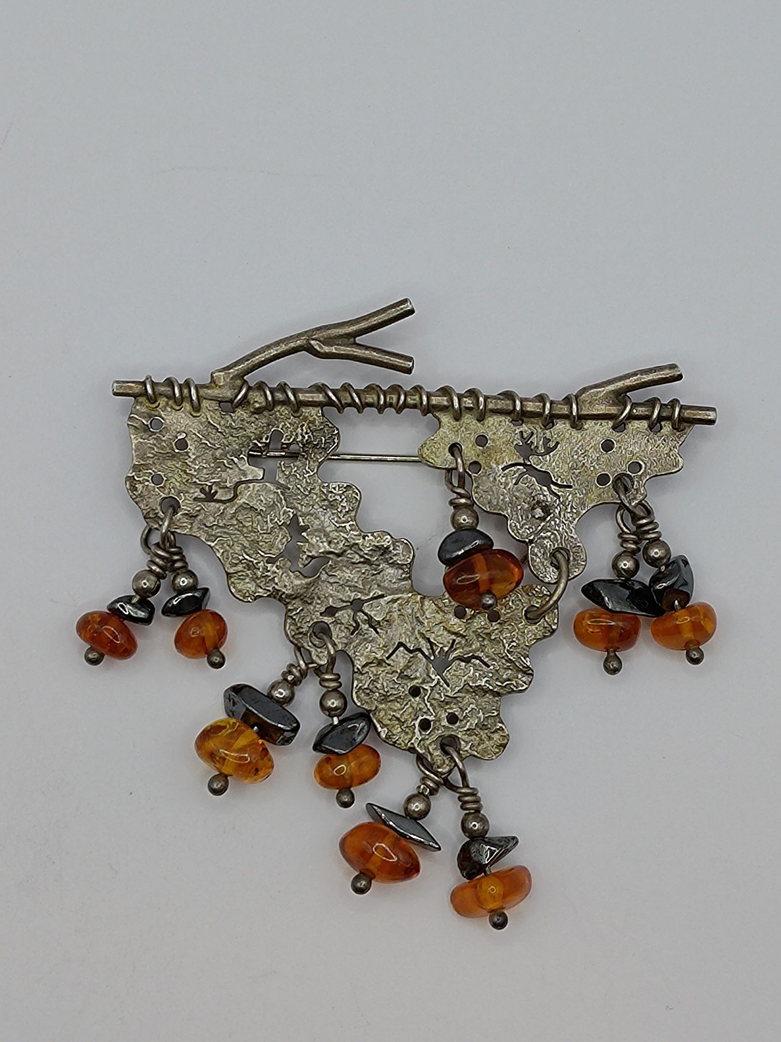 Native American, Hunting Scene Sterling Silver Brooch Set with Amber (1 of 6)