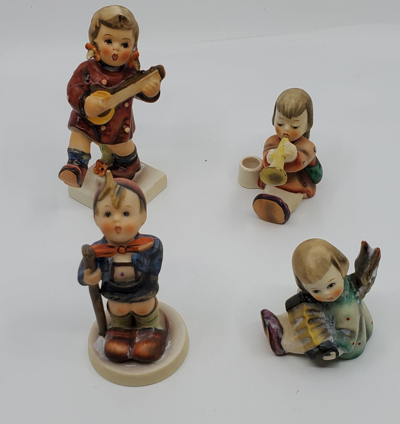 Lor of 4 Goebel Hummel W. Germany Figurines: Uncertain catalogue numbers. 2 1/2 to 4 1/2 " high.