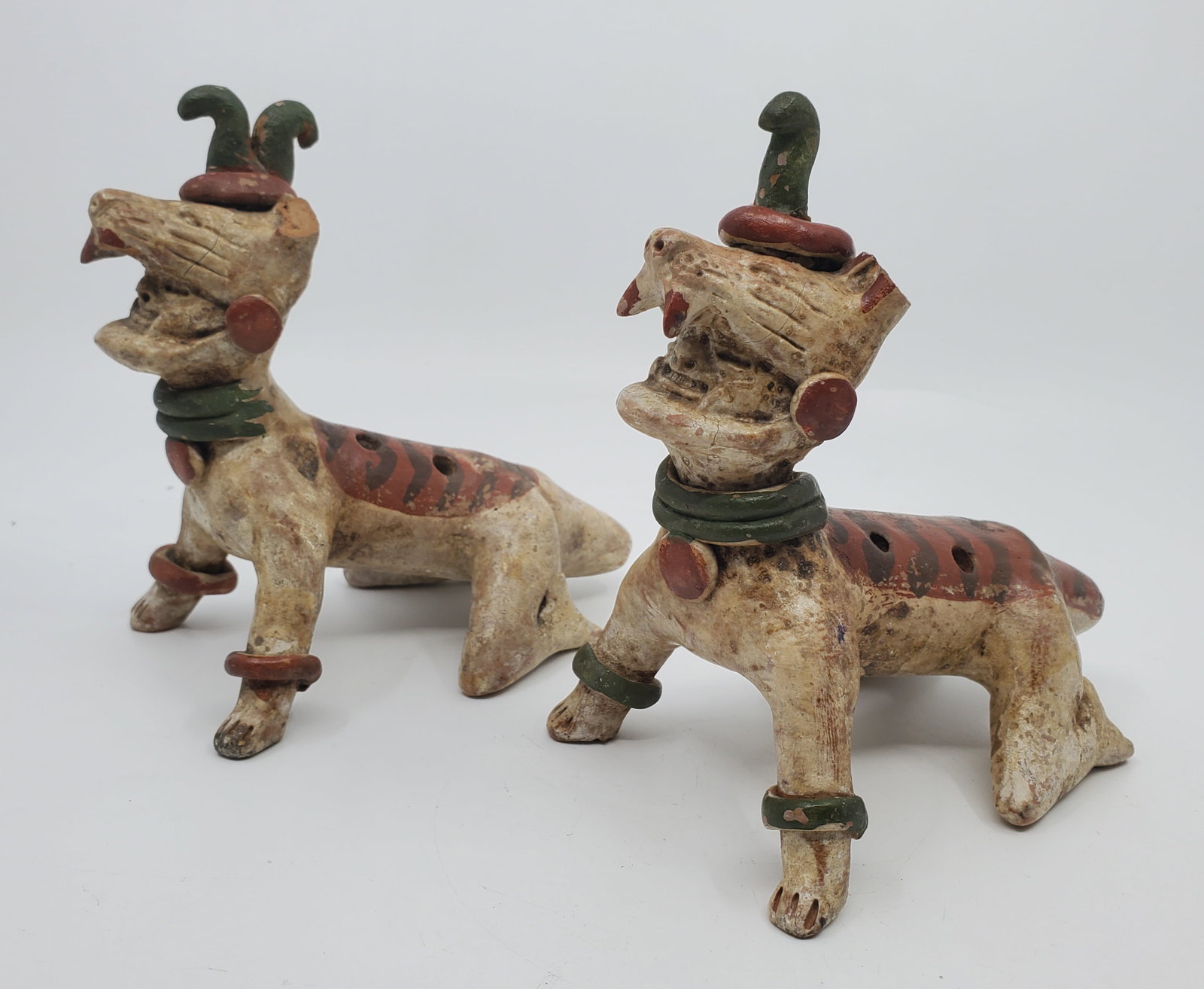 MEXICO Pair of fancy MAYA Ceremonial Flutes: Animal forms, with human faces in the mouths, Each c, 5 x 5 ".