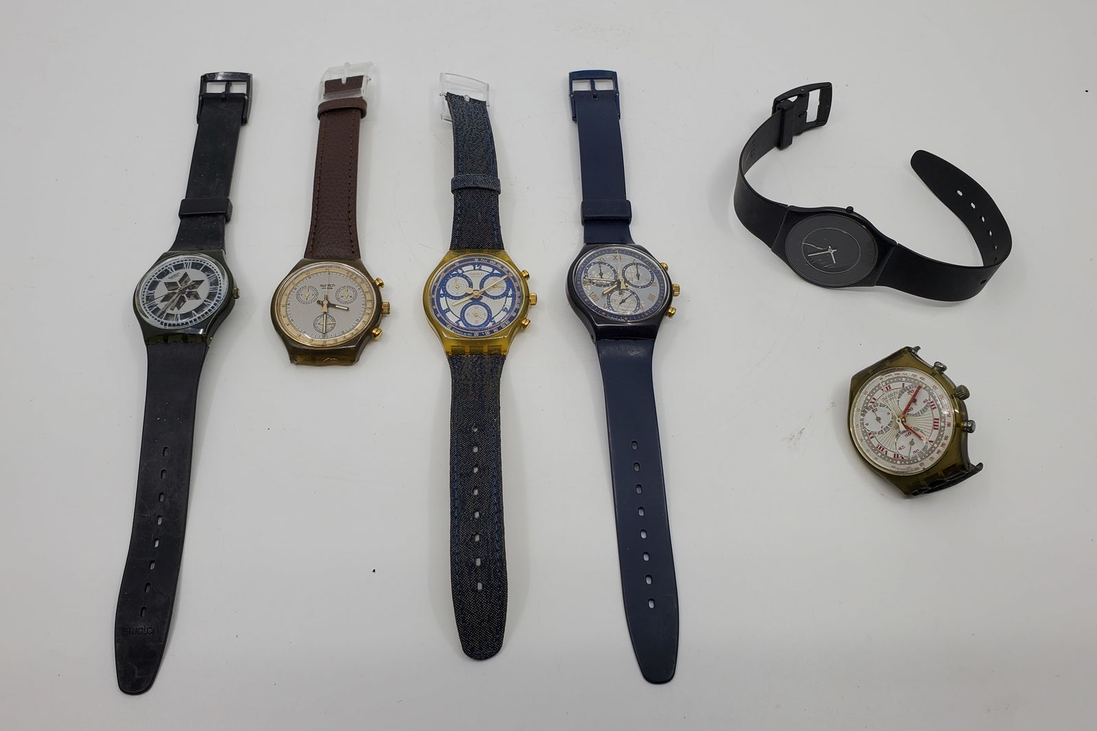 6 Different Swatch Watches: Unverified for function, but most likely new batteries are what's needed. Two have broken bracelets,
