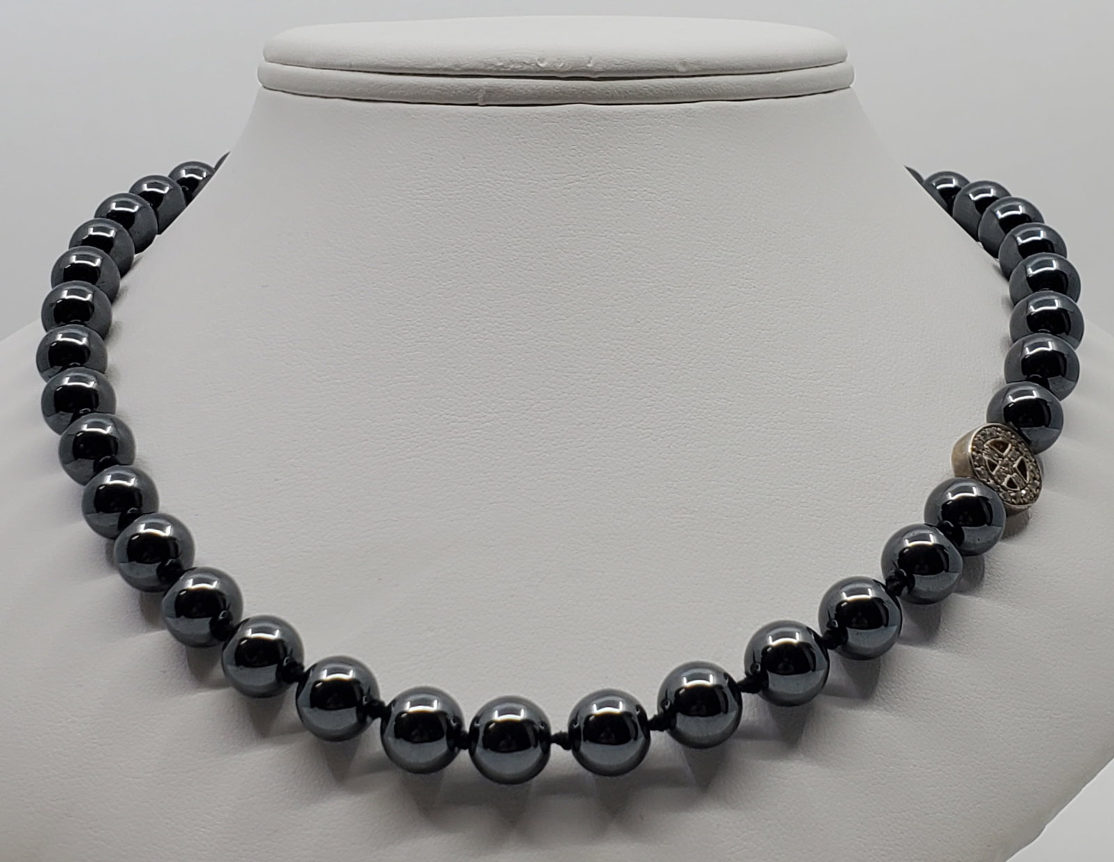 ANZIE Hematite Beads Necklace Sterling Silver Clasp: 61.55 grams. 41 - 8 mm hematite beads, Signed and stamped at clasp.