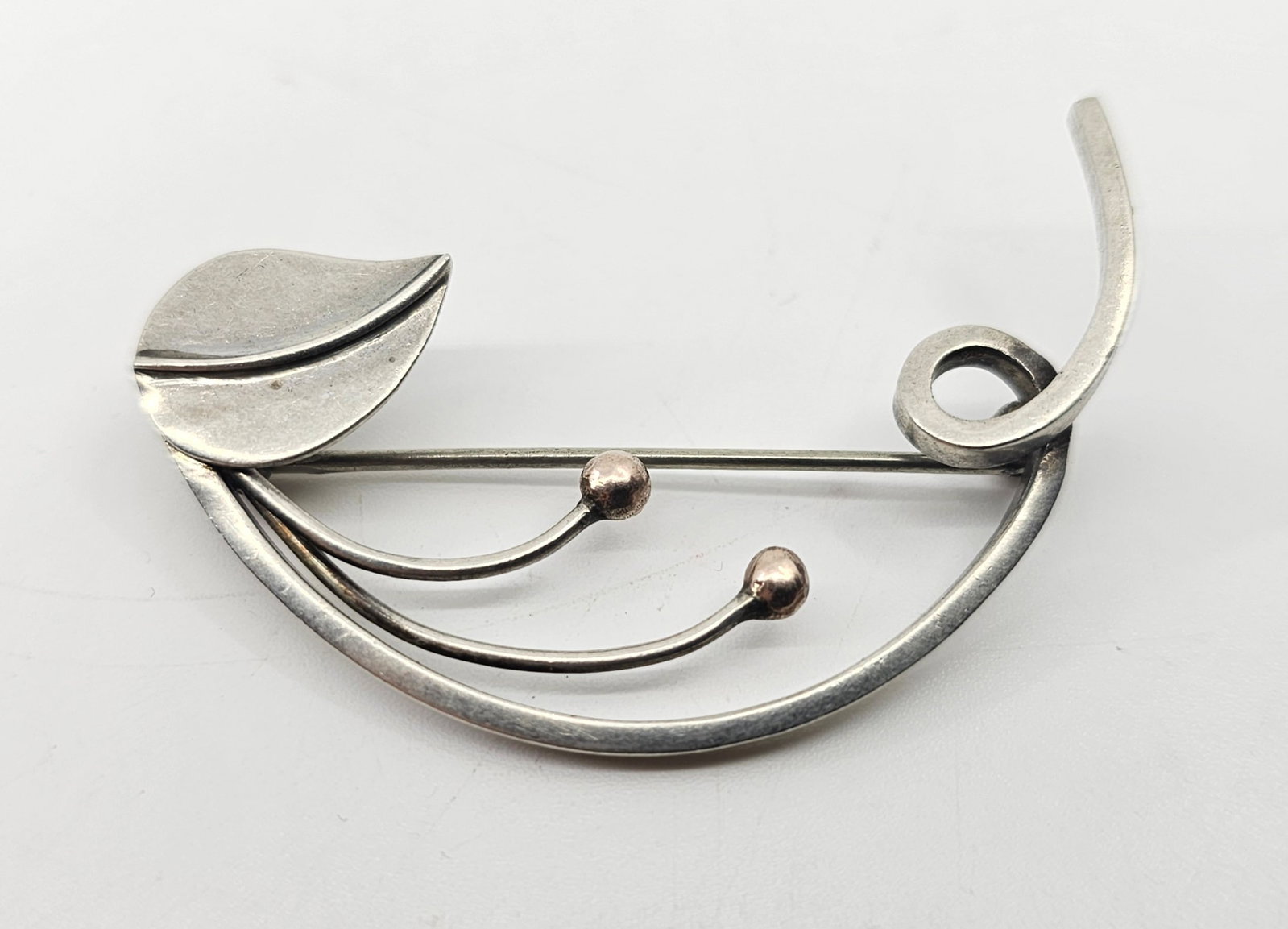 OPUS, Modernist Sterling Silver and 10K Gold Brooch: Sterling Silver and 10K Gold Modernist Brooch, signed on the back Ster Opus 10K 2" x 1 1/2" Weight: 5,7 g