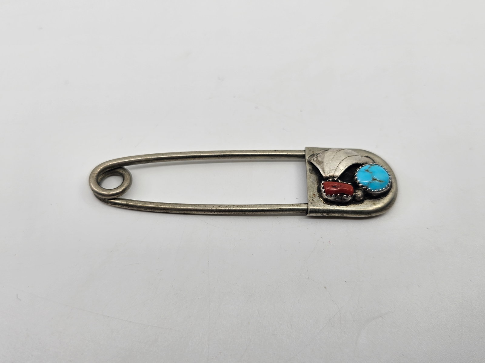 Vintage Navajo Sterling Silver Oversize Safety Pin, Diaper Brooch Set with Turquoise and a Red Coral: Sterling Silver Oversize Safety Pin, Diaper Brooch, set with a turquoise and a red Coral 3 1/4" x 1" Weight: 14,5 g