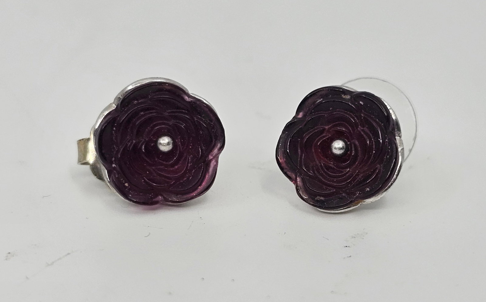 Lalique, France, Sterling Silver Earrings, with sculpted Flowers: Sterling Silver Earring, set with sculpted flowers, signed on the back Lalique 925 1/2" x 1/2" Weight: 6,5 g
