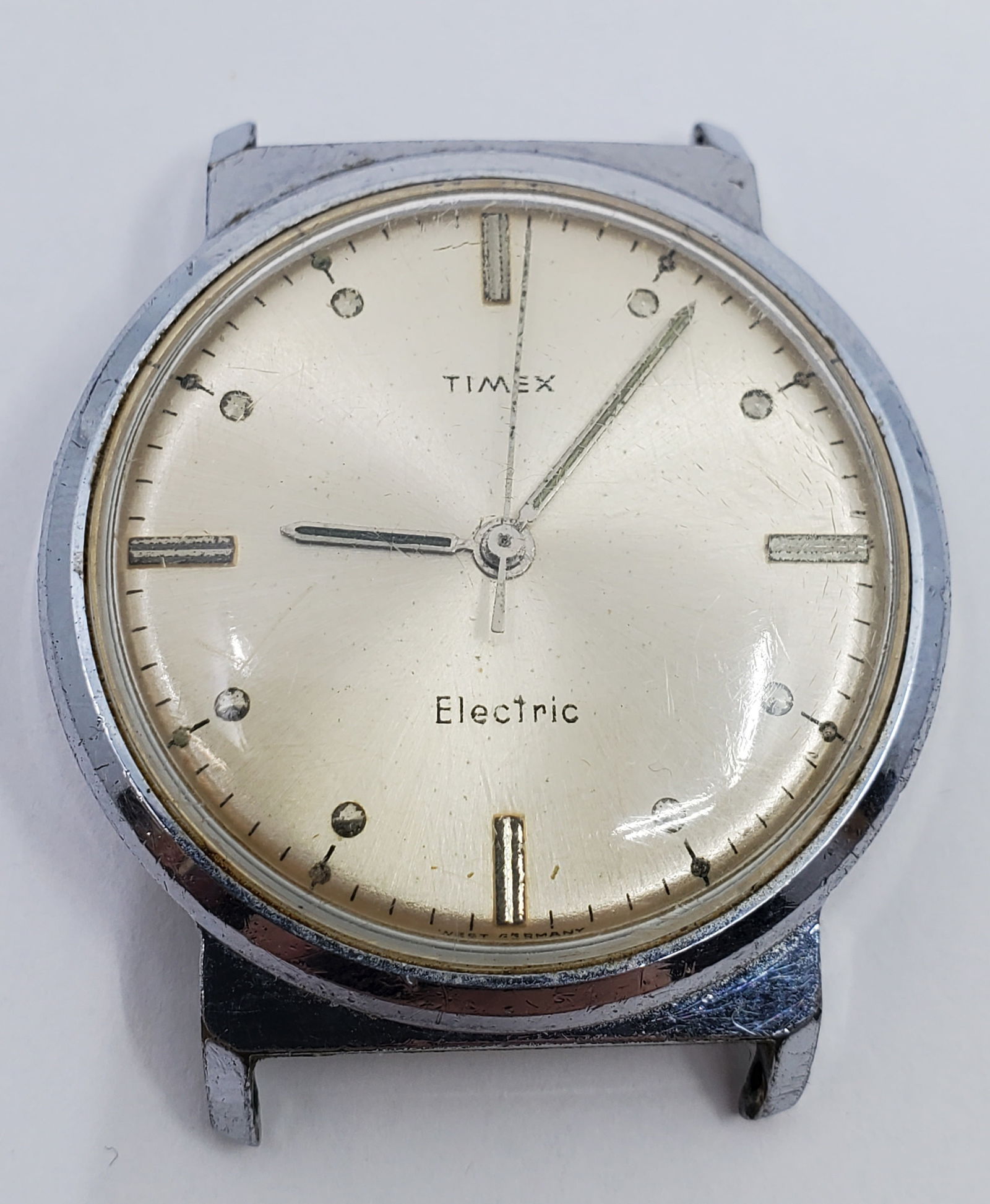 Early TIMEX ELECTRIC Men's Wristwatch: c. 1960's. Back set, so no crown. 35 mm diameter. Unsure if in working order, may simply need new battery, but sold as is.