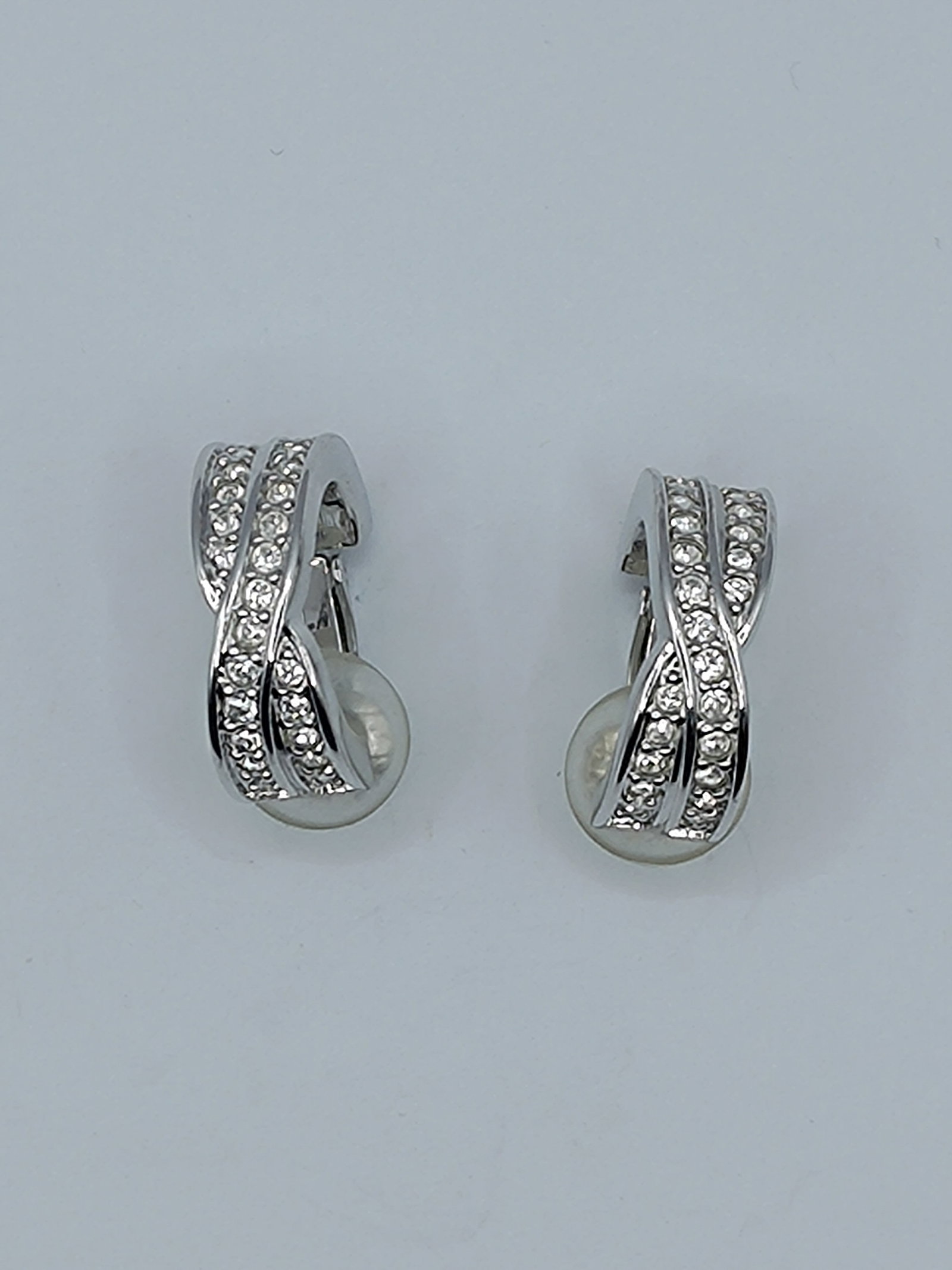Swarovski, Crystal Earrings: Pair of custom earrings set with crystal, signed on the attachment Swarovski 3/4" x 3/4" Weight: 8,7 g