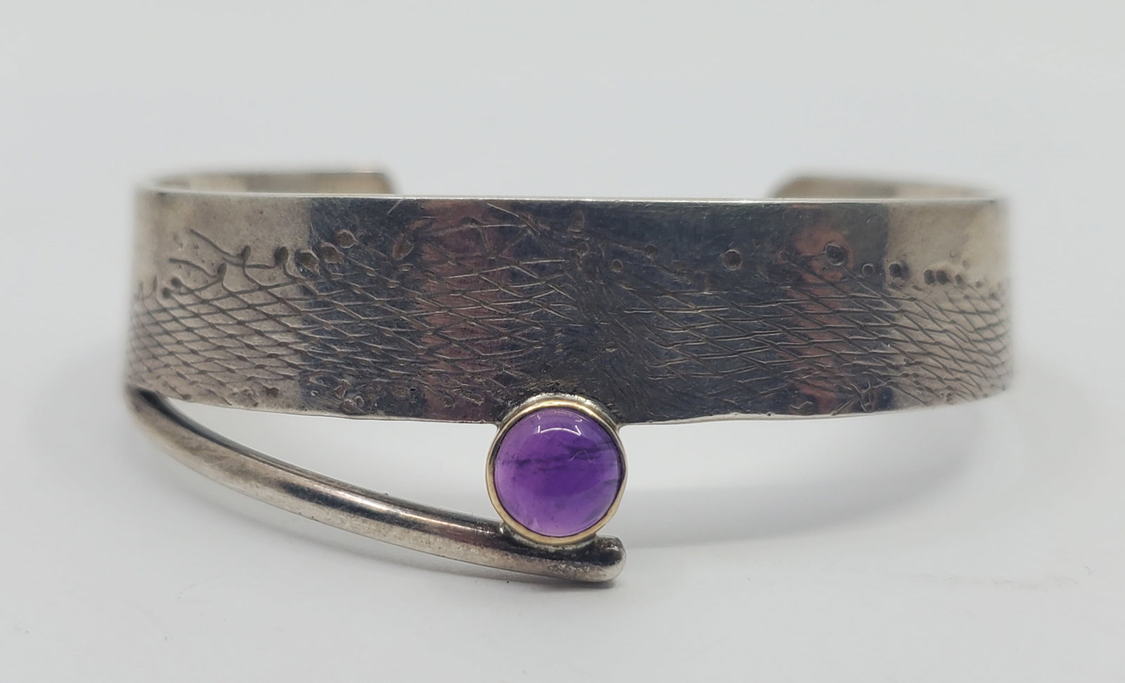 Modernist Sterling Silver and 10KT Gold Cuff Bracelet: Sterling Silver and 10KT gold cuff Bracelet, set with a stone, signed inside R G 10K 925 2 1/2" x 2" x 1" Weight: 26,6 g
