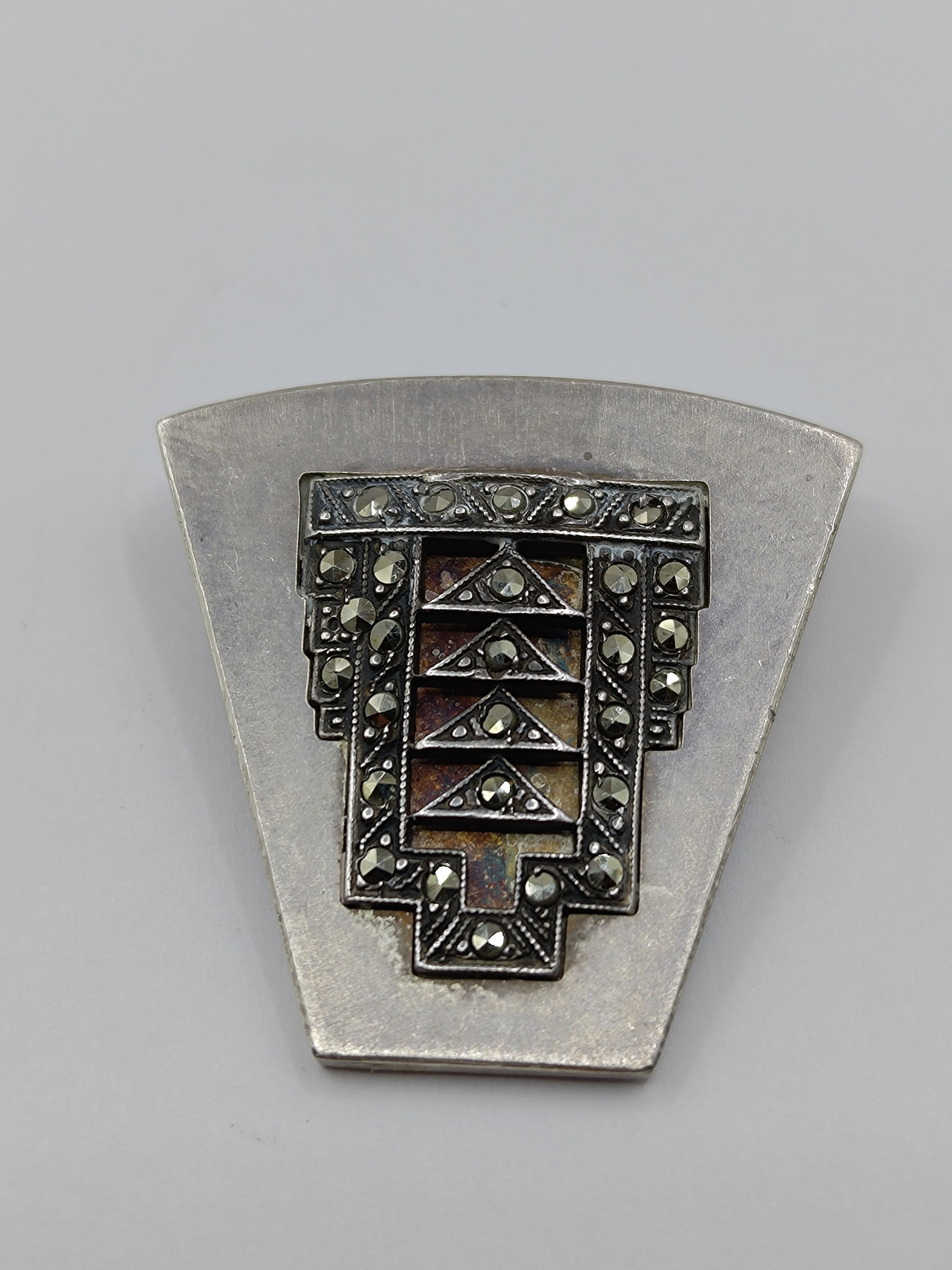 Janis Kerman, Canadian Moderist Sterling Silver Marcasites Brooch: Sterling Silver Brooch set with Marcasites, signed on the back Sterling Janis Kerman 1995 1 1/4" x 1 1/4" Weight: 9.2 g