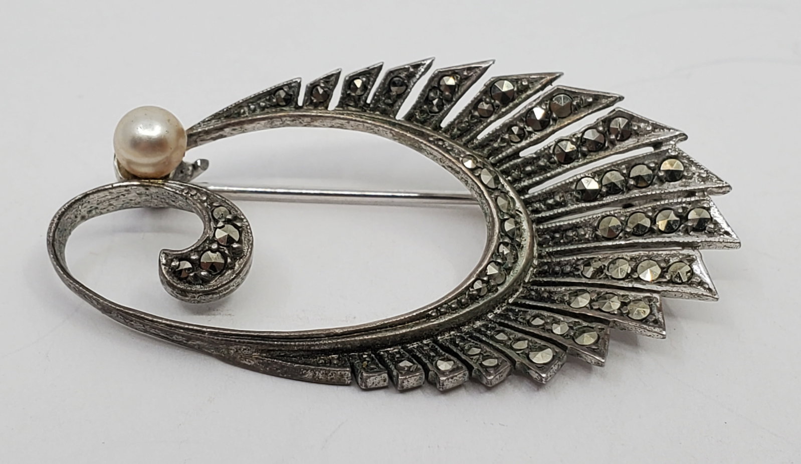 Antique Sterling Silver Marcasites Brooch: Sterling Silver Brooch, set with Marcasites, signed on the back Sterling 2" x 1" Weight: 7,7 g