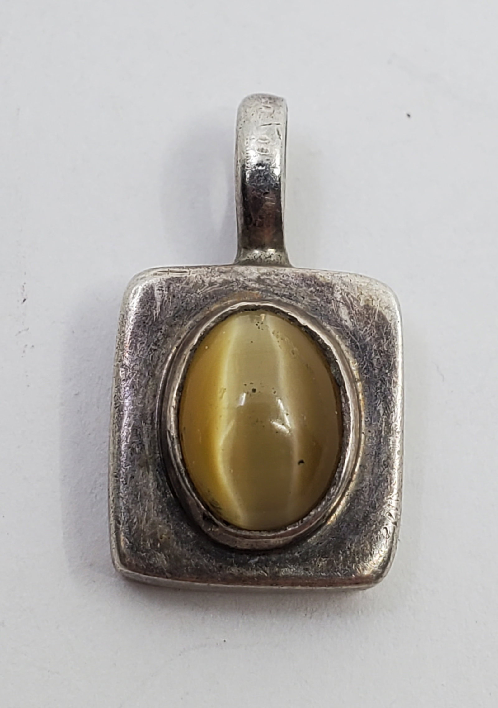 Soul Flower, Sterling Silver Cat Eye Pendant: Sterling Silver Pendant, set with a Cat Eye, signed on the back Soul Flower 925 3/4" x 1/2" Weight: 4,5 g