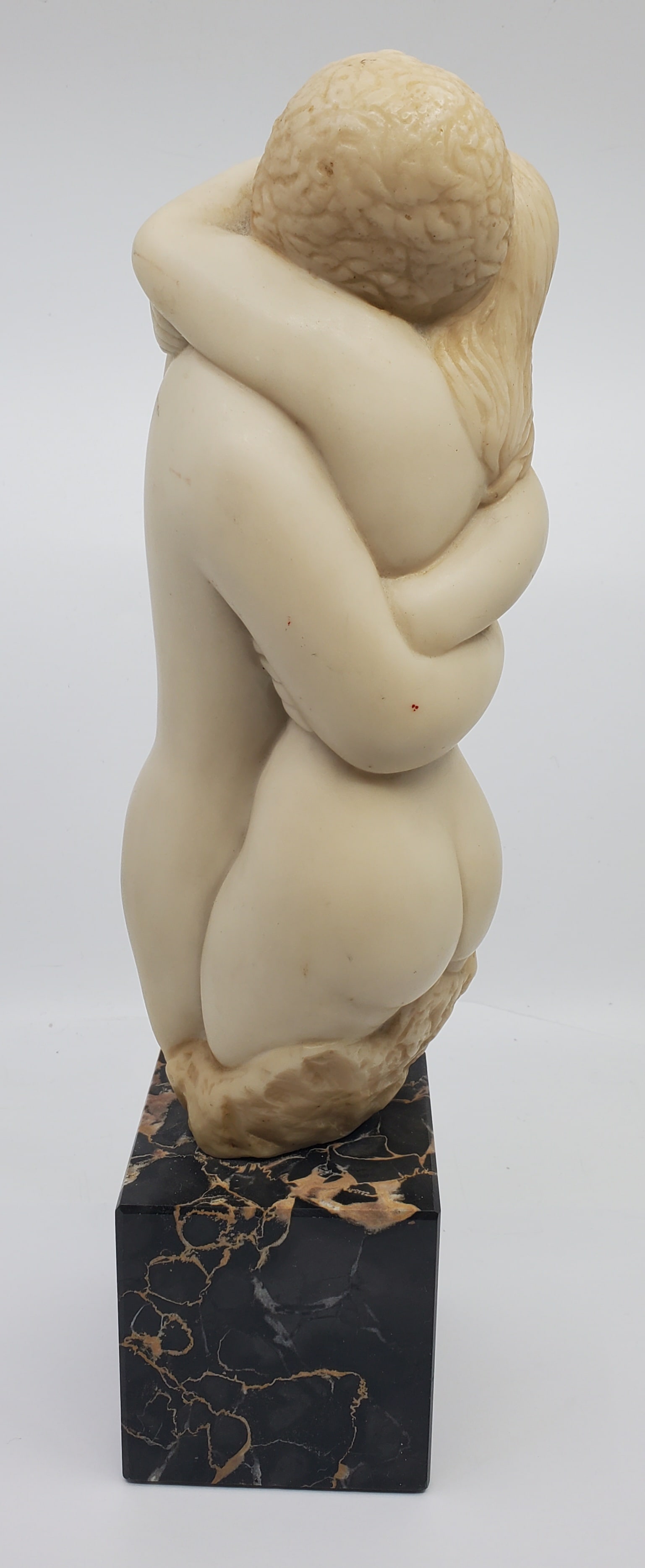 PEGGY MACH (US,1922-2013) White Resin Sculpture "Embracing Nudes": Black marble base measures aprox. 3" square. Sculpture is 4 x 10 ".