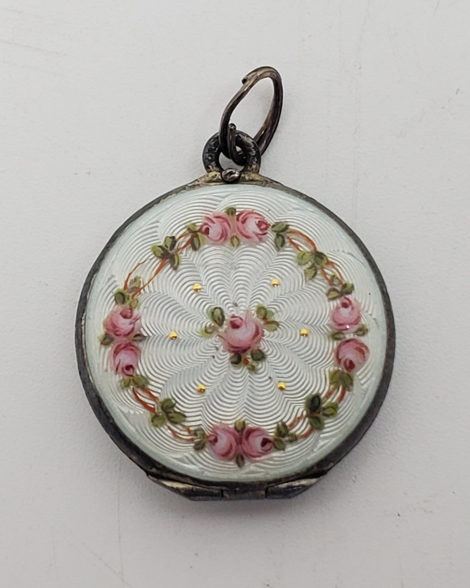 Vintage Sterling Silver White Enamel Locket Pendant: Sterling Silver Locket, with white enamel, marked inside M 12 1 1/4" x 1" Weight: 7,7 g