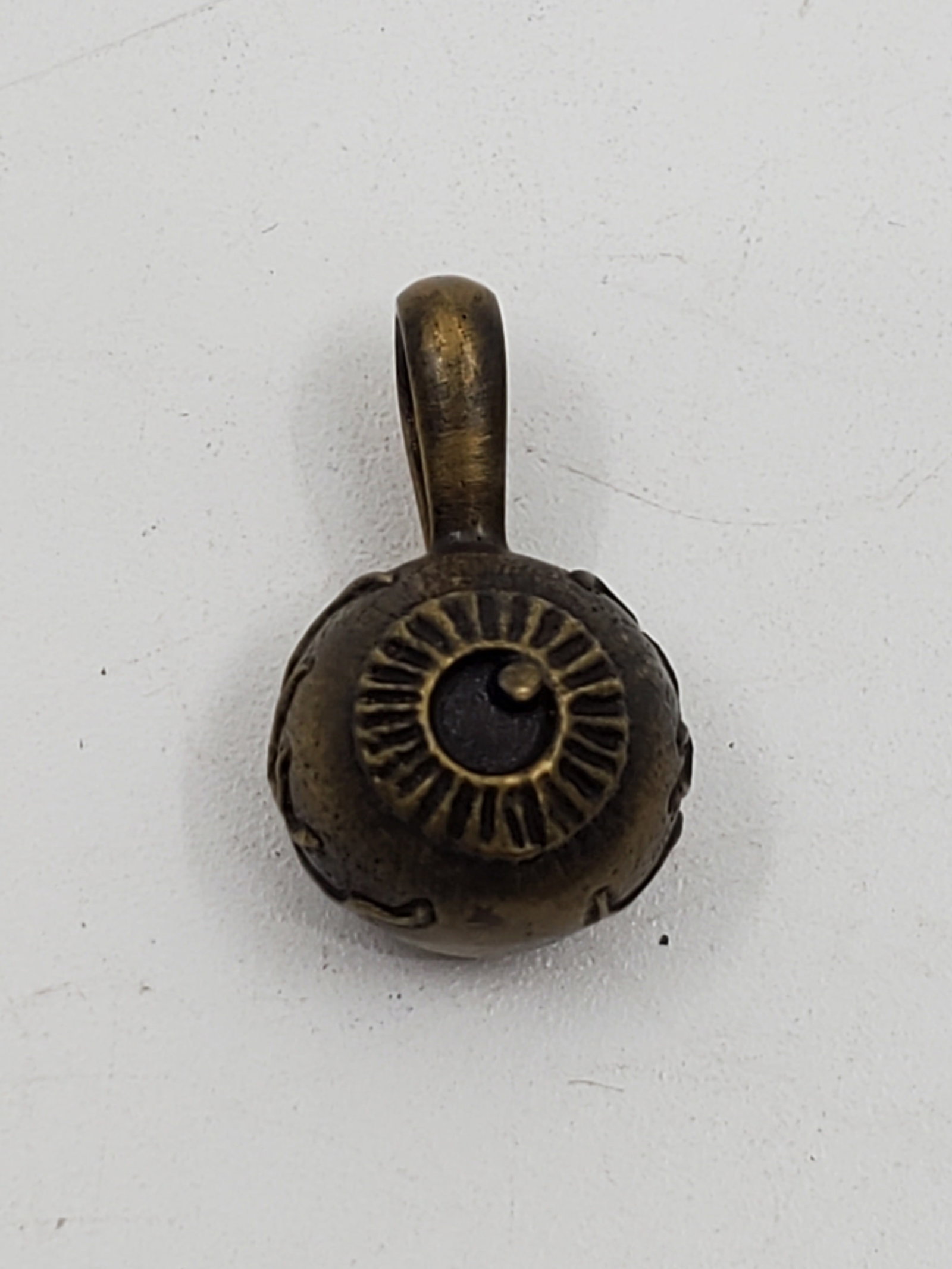 Strange Freak Designs, Japanese Bronze Eye Pendant: Bronze pendant, representing an eye, marked of the designer on the back 3/4" x 1/2"