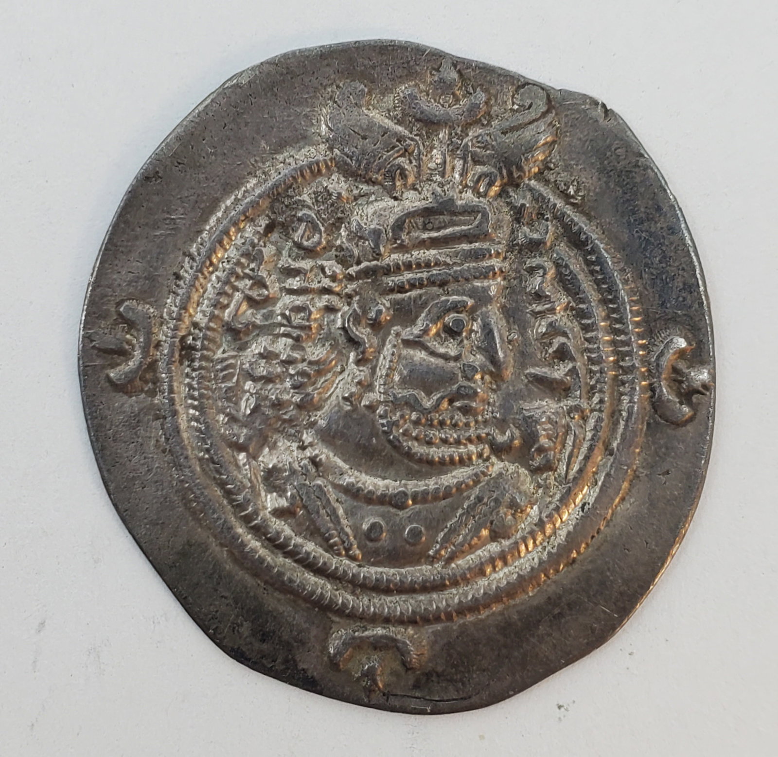 SASSANIAN PERSIA Silver Drachm of KHUSRU II c. 592 - 596 CE: 31 mm, 3.16 grams Bust of king rightwearingWinged helmet of the particular design identifying his reign / Zoroastrian Fire Altar, flanked by two priests. Very High Grade example.