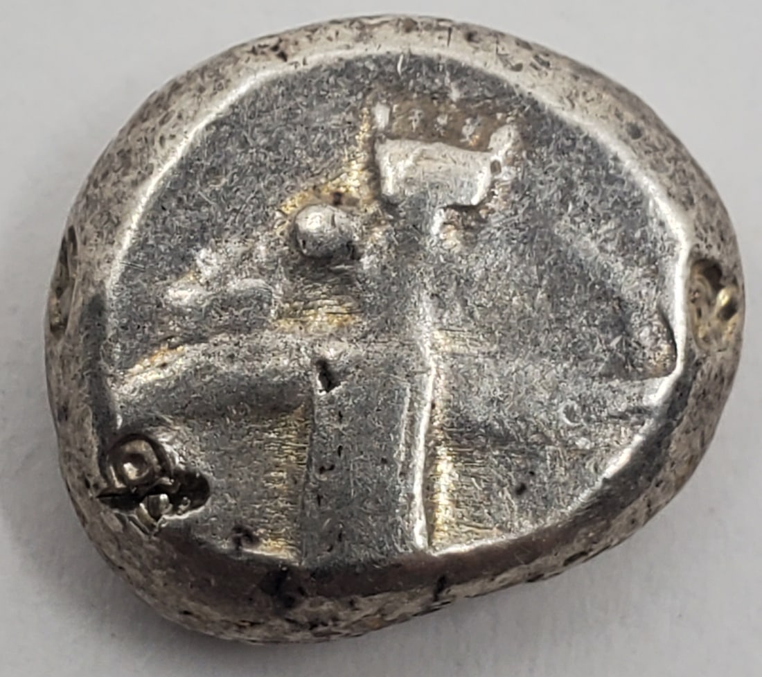 PERSIAN EMPIRE Lydia Silver Siglos Coin, c. 450-336 BCE: 5.54 grams, 13 mm. Obverse : Great King holding dagger and bow. Reverse : Oblong incuse pumch. These coins were probably struck for paying soldiers.