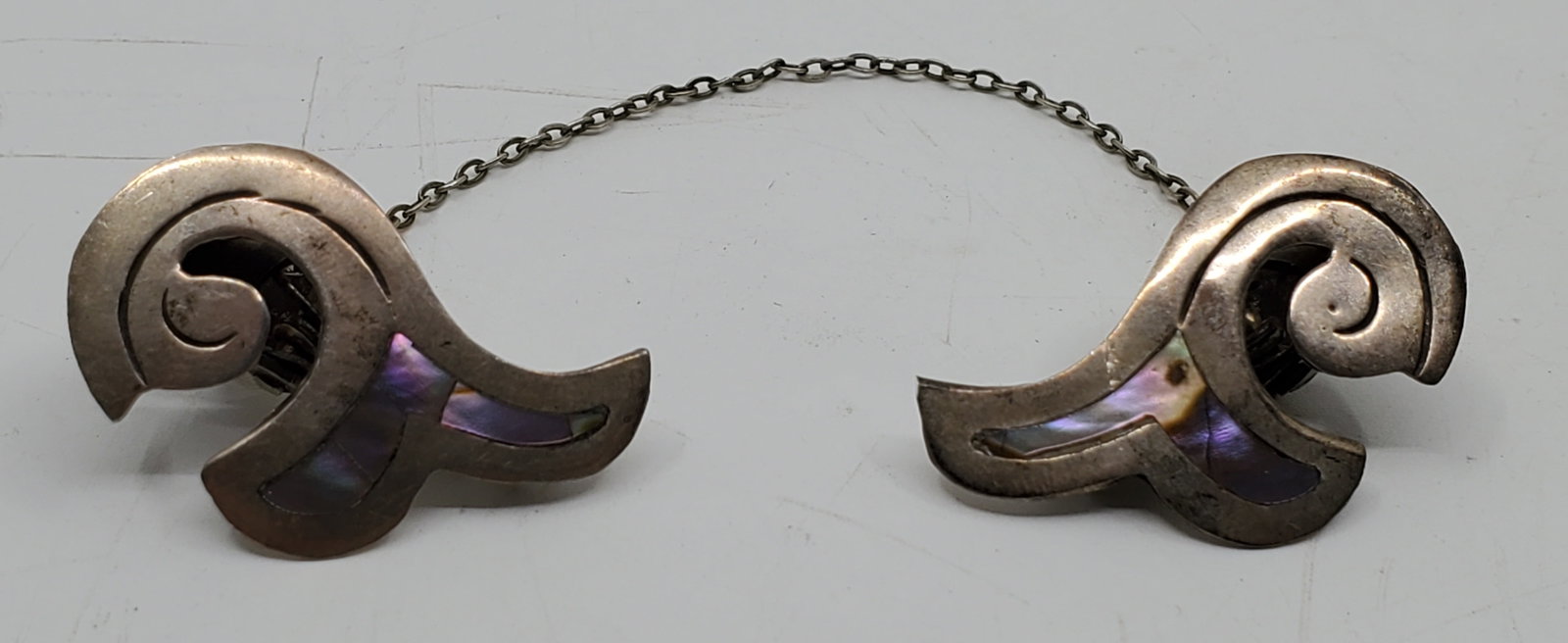 Mexican Sterling Silver Collar Decoration: Sterling Silver set with mother of pearl collar decoration, marked on the back 1 1/4" x 3/4" Weight: 8,7 g
