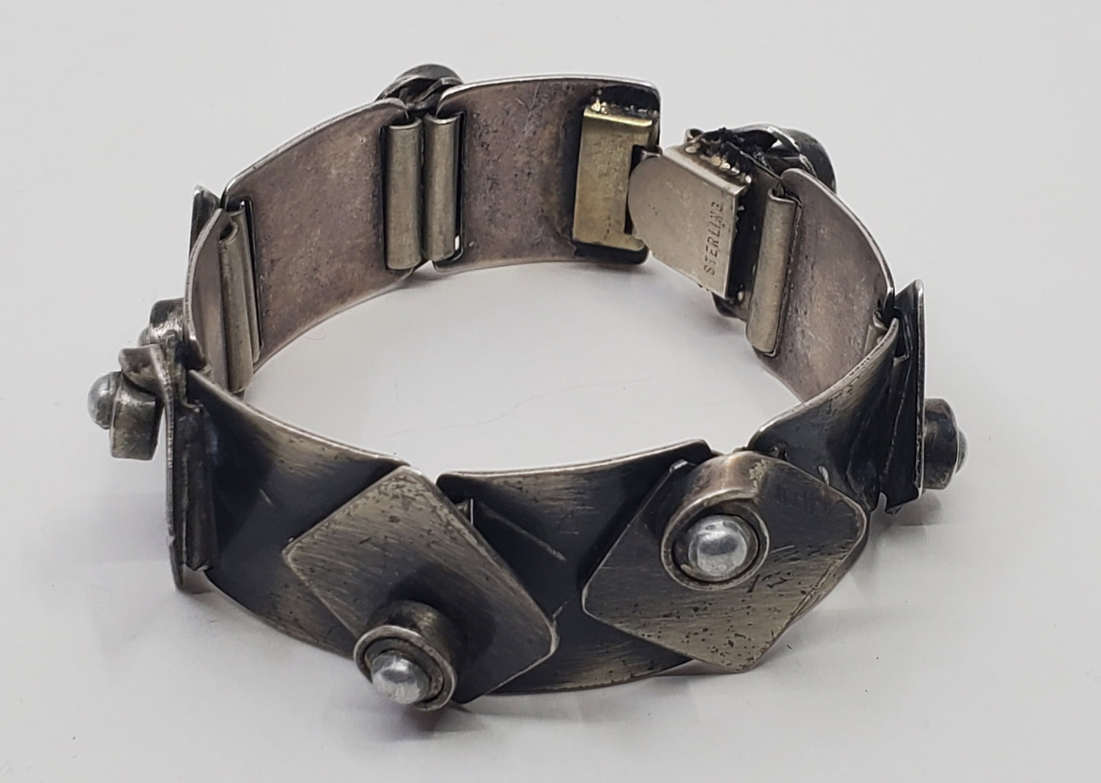 Frank Rebajes (1907-1990) American Modernist Sterling Silver Bracelet: Sterling Silver Bracelet, marked on the top near the clasp Rebajes Sterling 7" x 1" Weight: 62,6 g