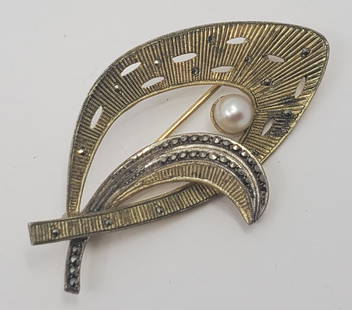 Theodor Fahrner (1859-1919) German Art Deco Guilted Sterling Silver Brooch: Sterling Silver Guilted Brooch, set with a Pearl and Marcasites, marked on the back 925 TF 2" x 1" Weight: 7,8 g
