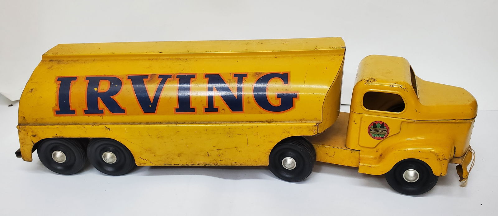 Vintage OTACO MINITOY Pressed Steel Irving Oil Tanker Truck Toy: These toys were manufactured by Otaco (Orillia Tudhope Anderson Company) in Orillia, Ontario, Canada. Minitoys were produced primarily for the post-war "baby bomm" market of the late 1940s-1950s, They