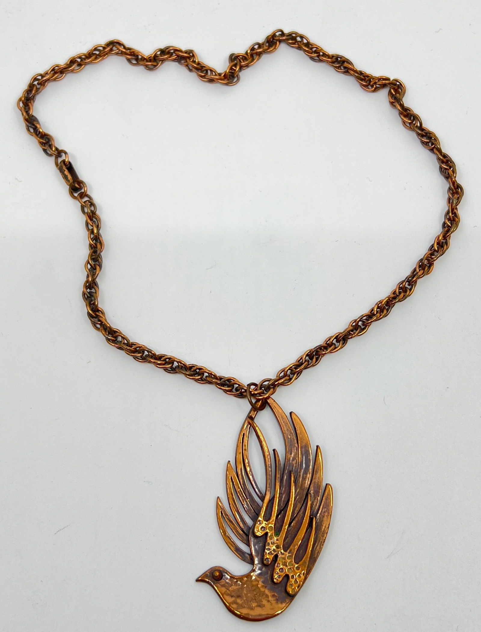 Frank Rebajes (1907-1990) American Modernist Copper Bird Pendant Necklace: Copper Bird Pendant Necklace, marked on the back of the pendant Rebajes and on the clasp of the chain Rebajes Pendant : 2 1/2" x 1 3/8"Chain : 19"