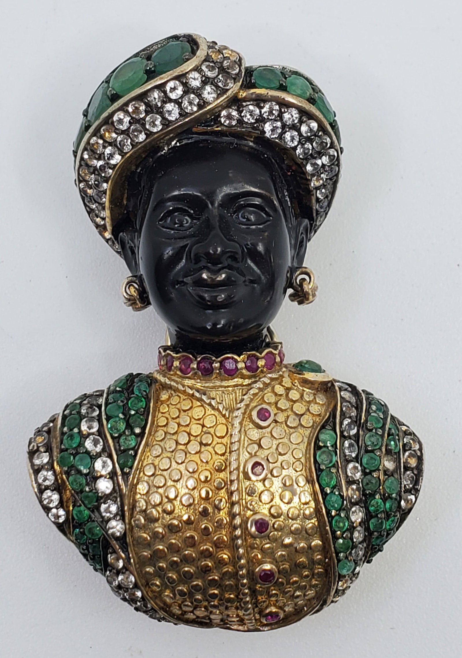 Jarin Sterling Silver Onyx Blackamoor Brooch: Jarin Sterling Silver Onyx Blackamoor Brooch Inset with raw emerald's and crystals Guilted Silver, Marked on the back Jarin 9252" x 1 1/4"Weight: 28,1 g