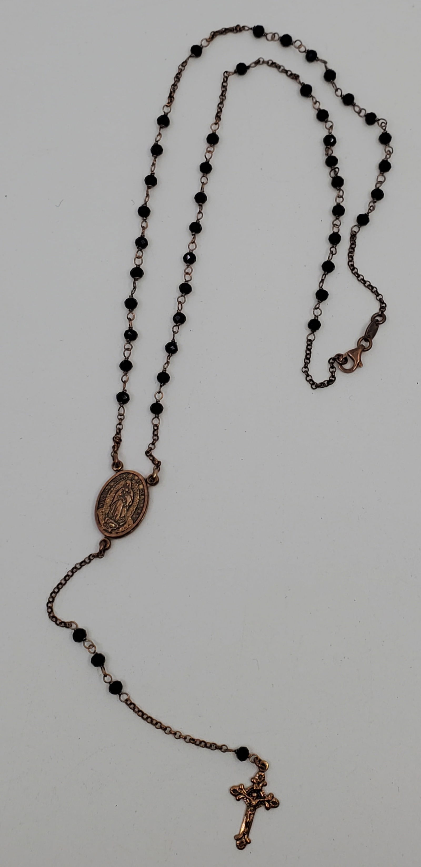 Vintage DYADEMO ITALY Sterling Silver and Onyx Rosary: Made for the Mexican market, as text in Spanish and featuring the Virgin of Guadelupe. The silver is gold plated. 8.78 gr. total weight. 14 1/2" in length.