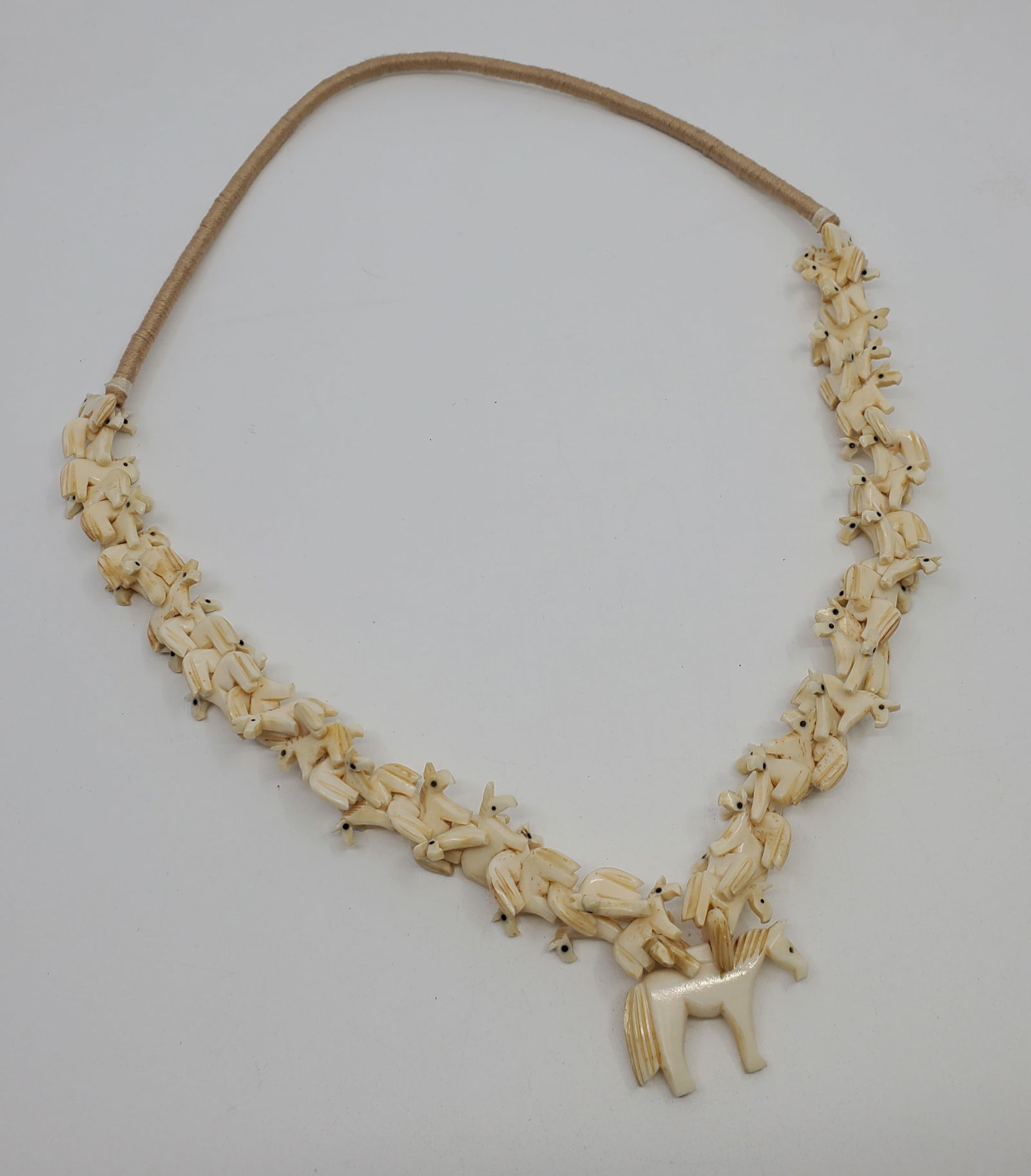 ZUNI New Mexico Carved Bone Horse Fetish Necklace: Falls approximately 15". ,