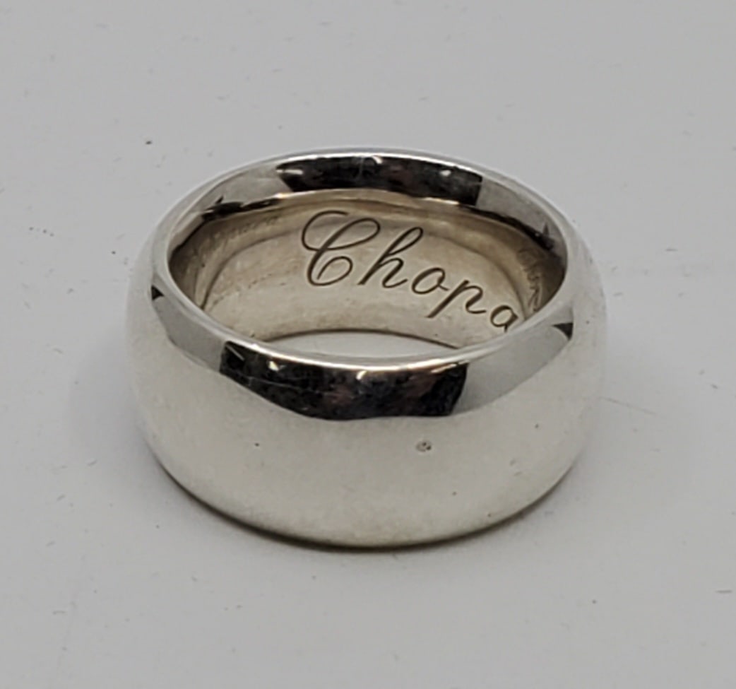 CHOPARD Limited Edition Silver Ring: Size 9 1/4 24.24 grams 11 mm wide. Signed inside, and stamped LIMITED EDITION, and serial numbered. Not hallmarked but verified by testing as 90% silver, 10% copper.