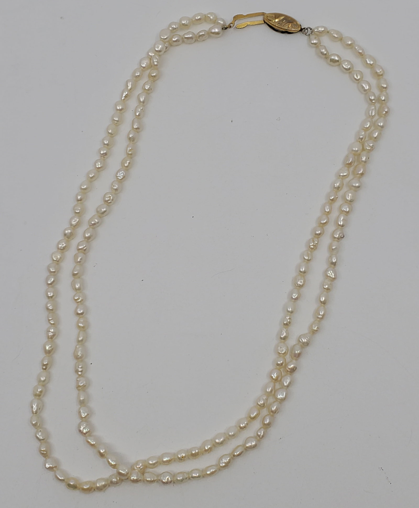 Double Strand of Freshwater Pearls: 16" long. Clasp is stamped SILVER
