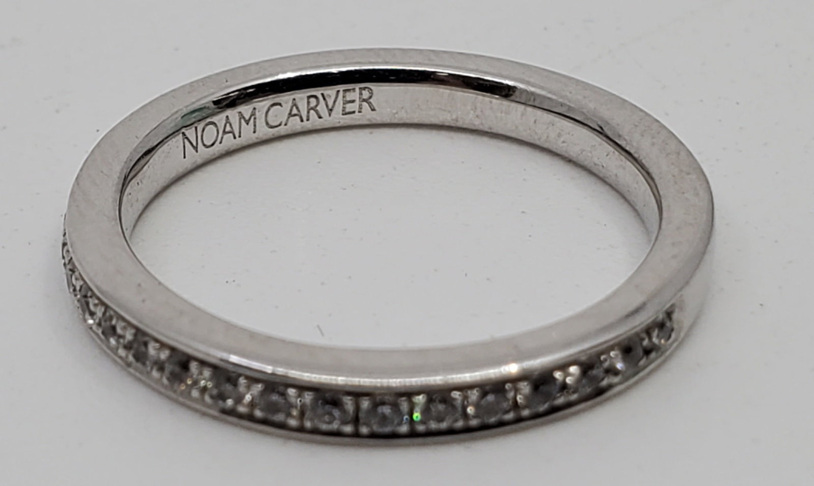 Ladies NOAM CARVER 925 CZ Semi Eternity Band: Size 6 1/2 Weighs 2.65 grams Stamped 925 and signed NOAM CARVER Set with small cubic zircona around aproximately 55-60% f the circunfrence.