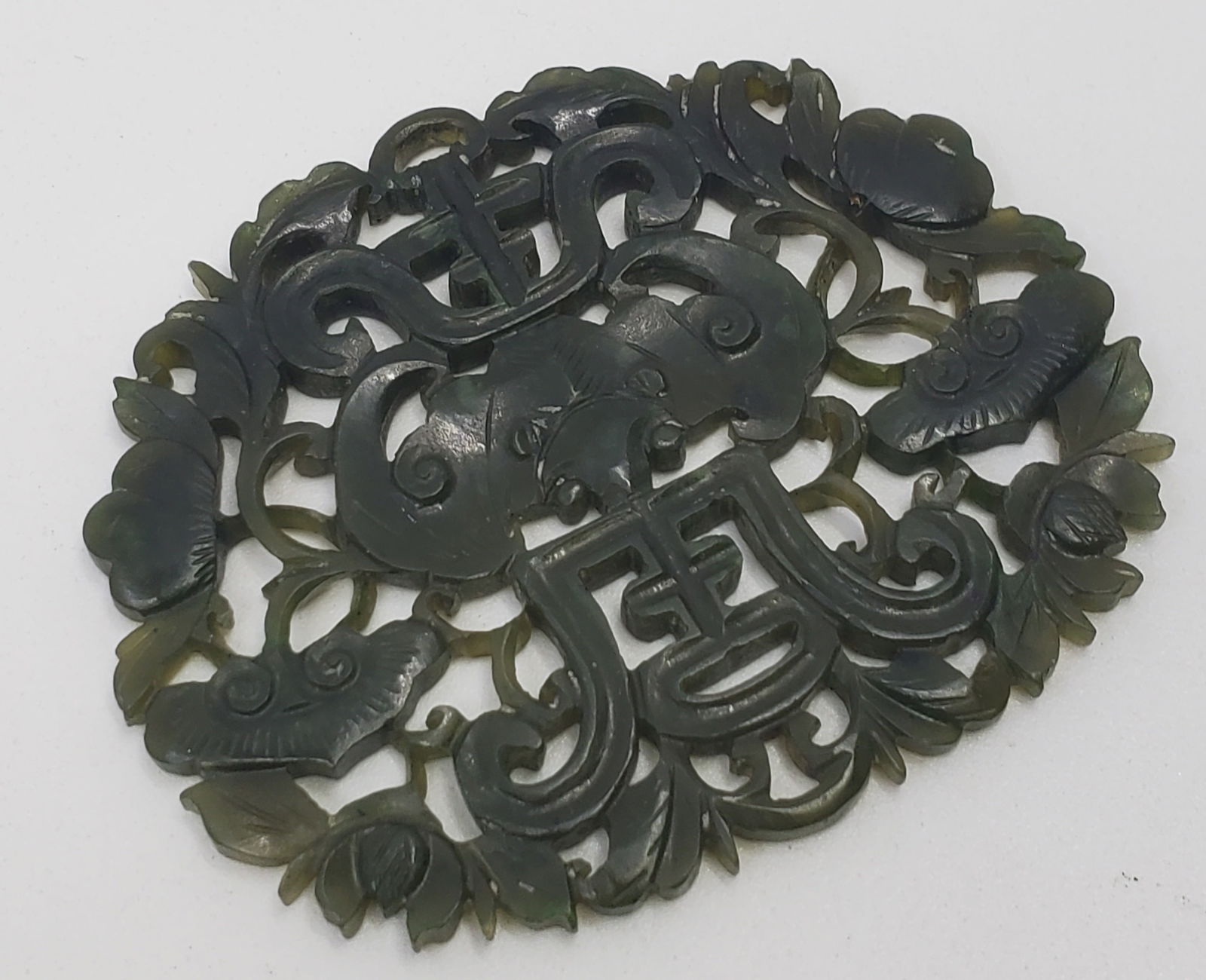 Vintage Chinese Carved Jade Plaque Amulet with Bat Motif: 53 x 65 mm, 17.73 grams Deep green natural jade.