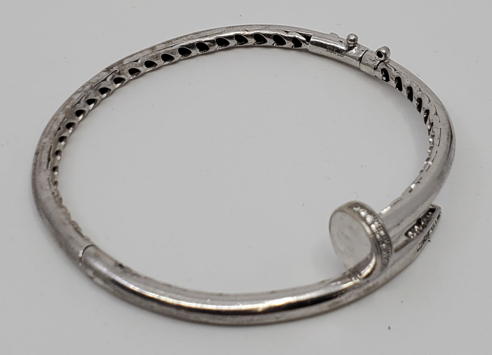 Handmade Sterling Silver Bracelest with CZs: 14.49 grams 50 x 58 mm internal measurement. Stamped 925. Set with small cubic zircons or crystals,