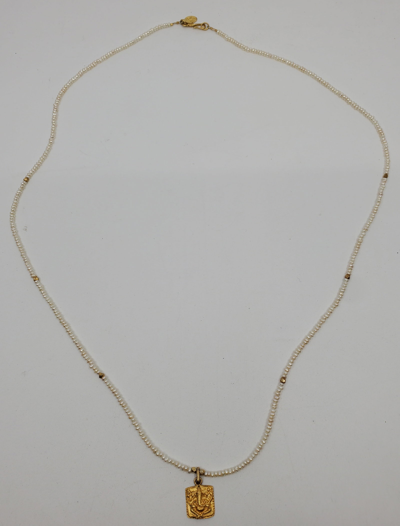 INDIA Gilt Silver Pearls Necklace with Ganesh Pendant: Hanging length is 16 Strung with small freshwater pearls and silver gilt beads. The pendant mesures 15 mm, stamped 925 and gilt. with a facing figure of thr god Ganesh.