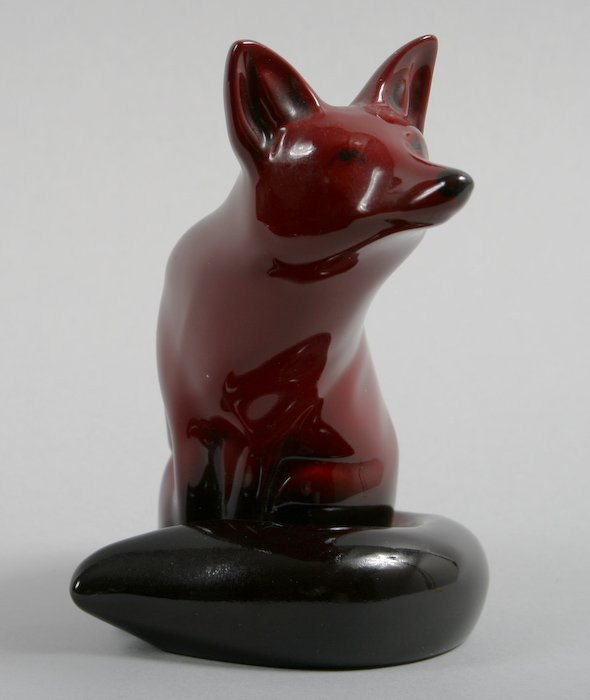 Royal Doulton Flambé Seated Fox: 19th/20th Century School, Royal Doulton Flambé Seated Fox (Model no. 14) and Boy with Rabbit, hand-painted porcelain and ceramic figurines, fox numbered and stamped on base "14/ MADE IN ENGLAND/ ROYA