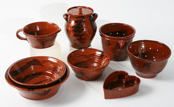 Lester Breininger, Glazed Redware Kitchen Cookware: Lester Breininger (American, 20th Century) Eight Pennsylvania German Glazed Redware Kitchen Cookware Pieces, ranging in size from 7-1/2 to 8 inches (height), signed and dated (each). Provenance: The B