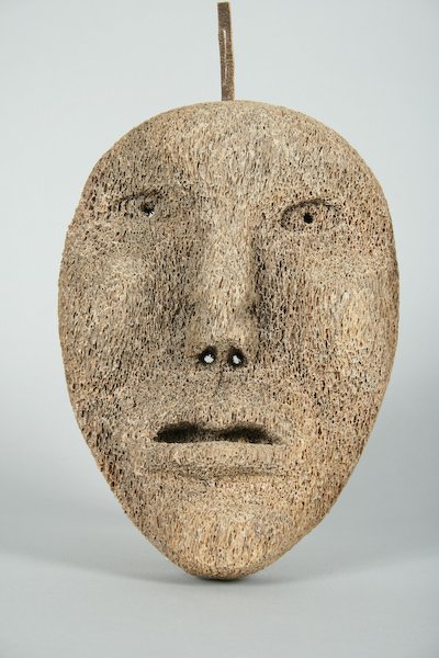 Inuit Carved Whale Bone Mask: Inuit Carved Whale Bone Mask, 8-1/2 x 6 x 2-1/2 inches. Provenance: Nina Hellman, Katonah, NY; The Betty Gordon Estate.